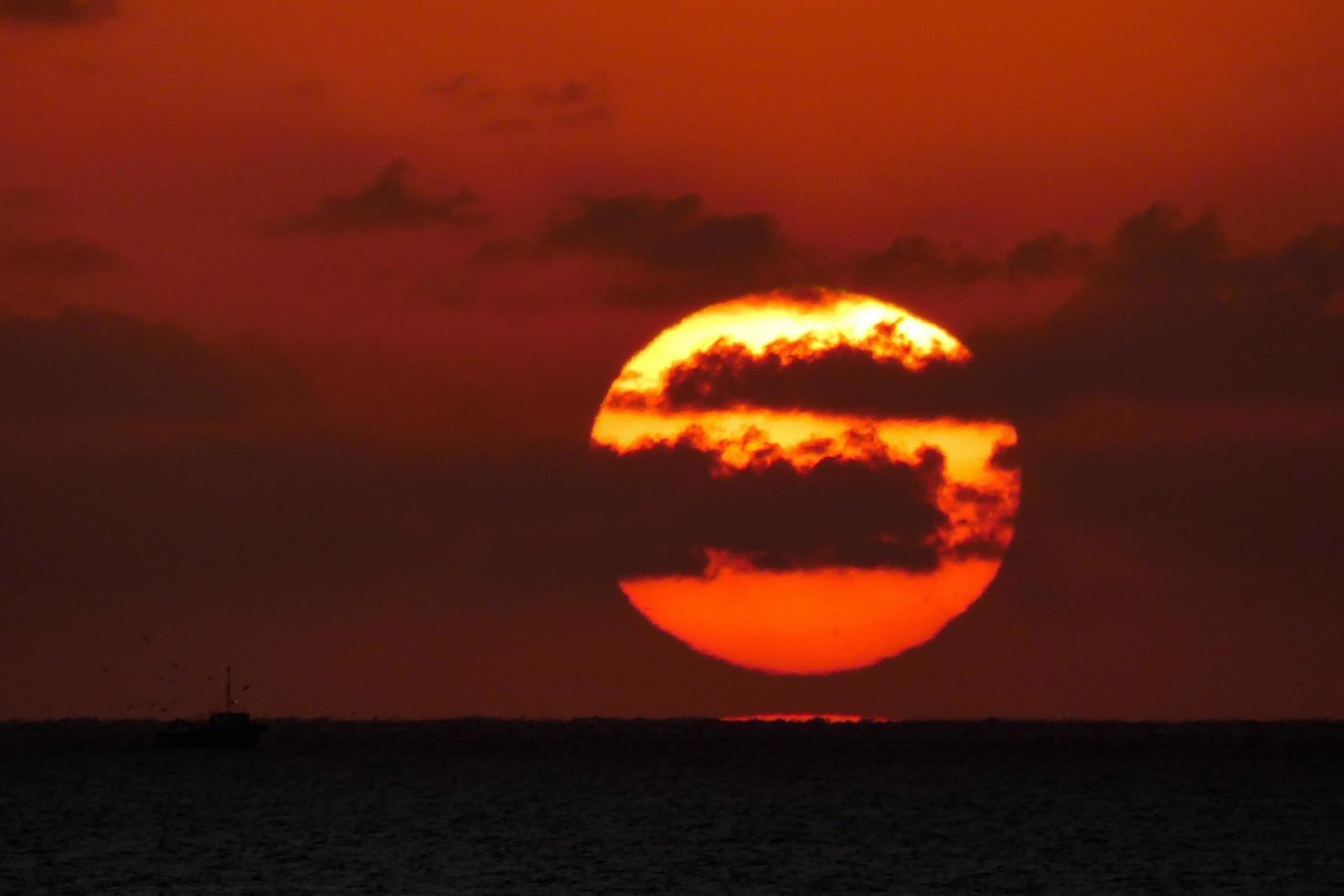 Sun disk rising over the horizon of the sea, sunrise, dawn photo