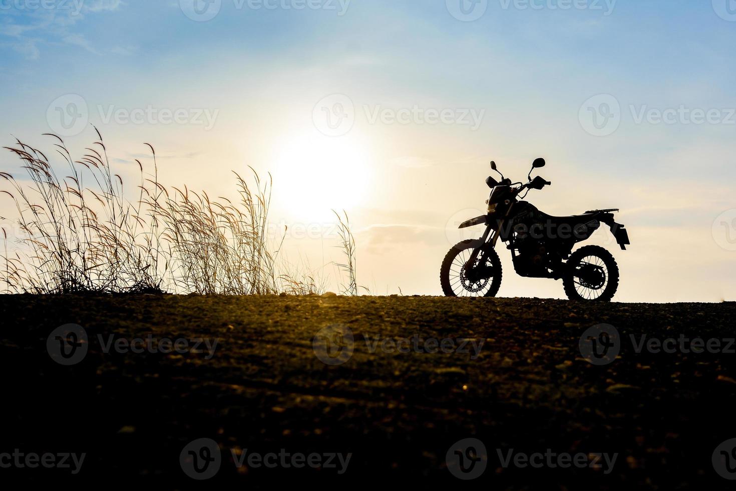 Motocross on a beautiful light mountain independent adventure tourism concept photo