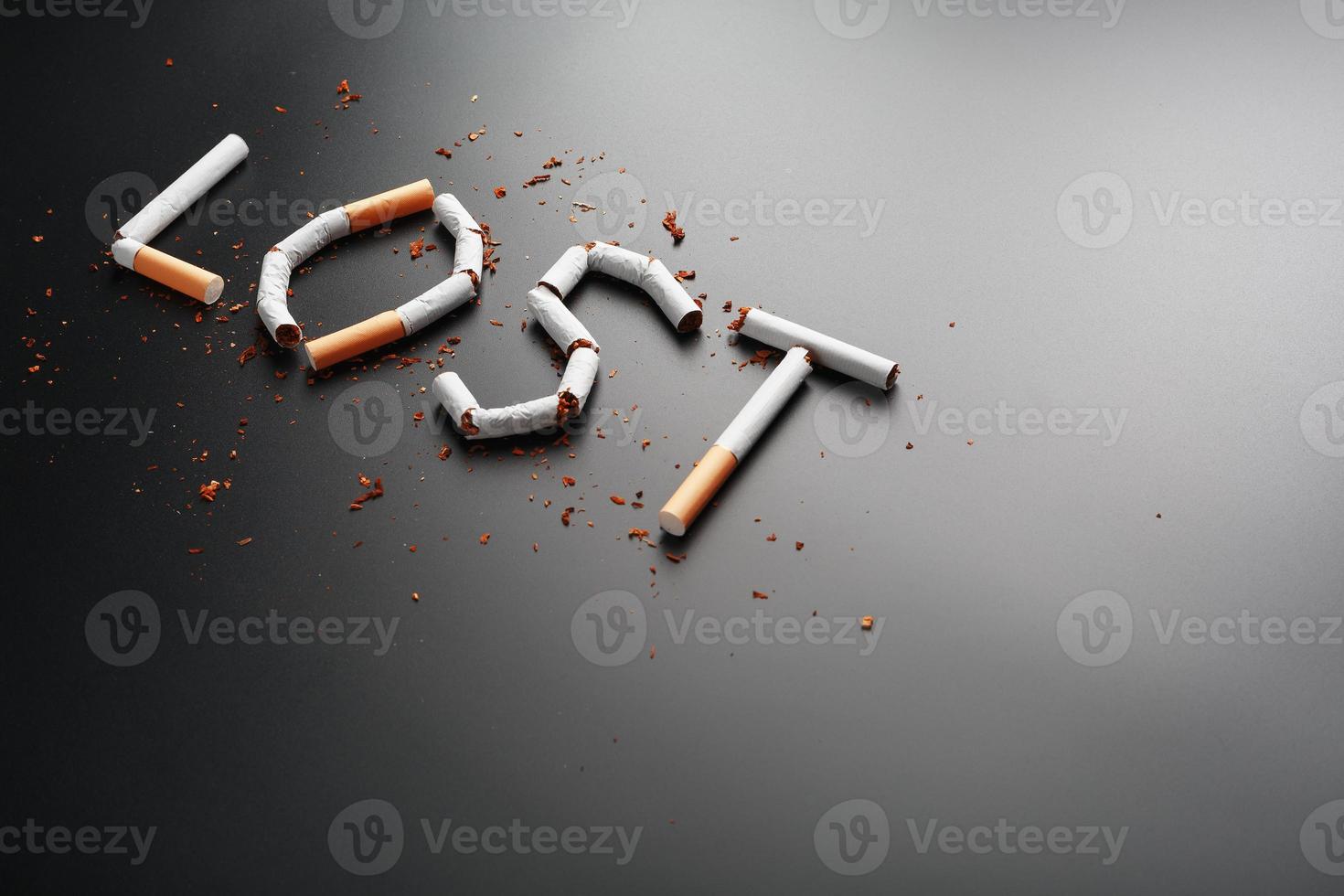 The inscription LOST from cigarettes on a black background. Stop smoking. The concept of smoking kills. Motivation inscription to quit smoking, unhealthy habit. photo