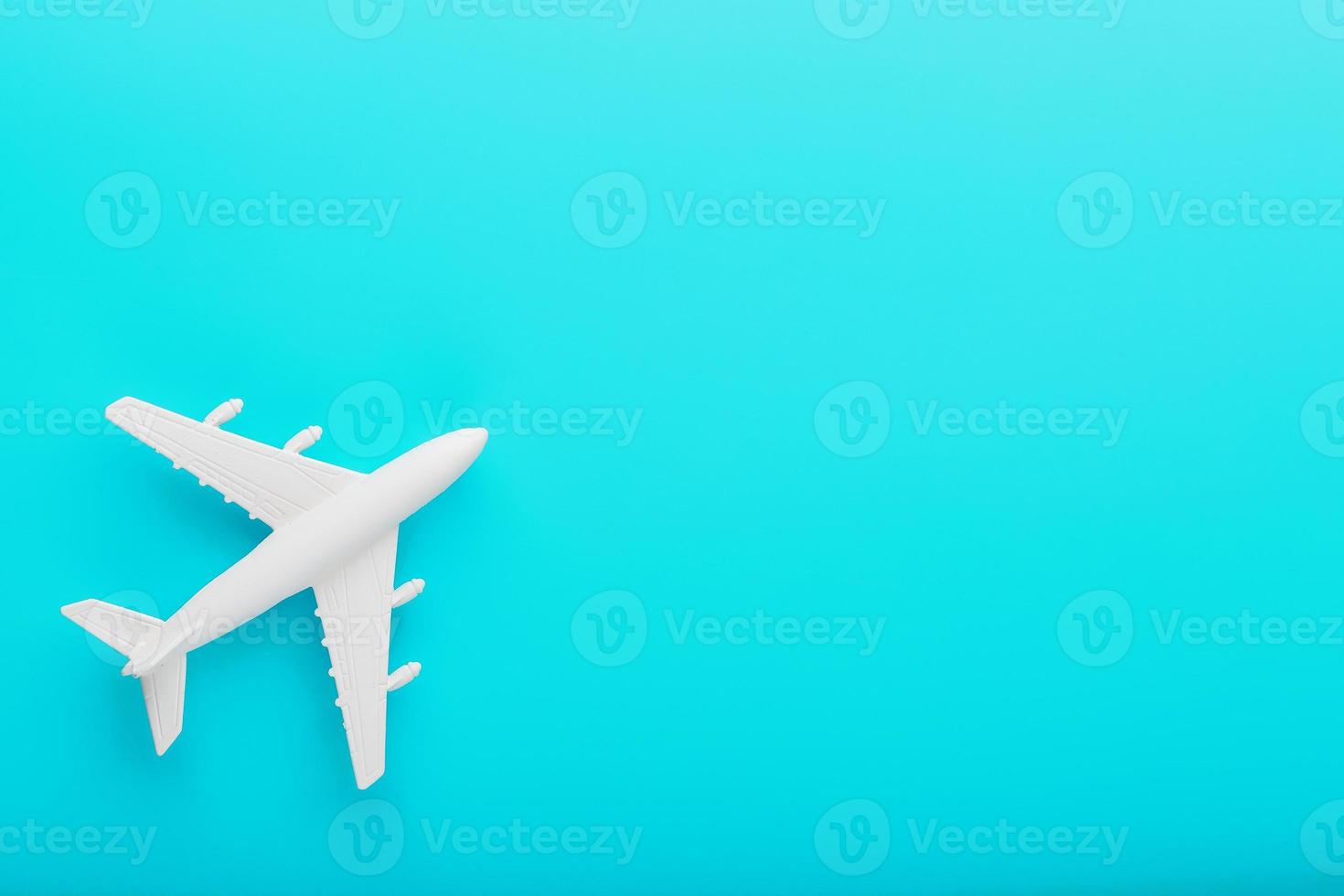 White passenger plane on a blue background. Free space. photo
