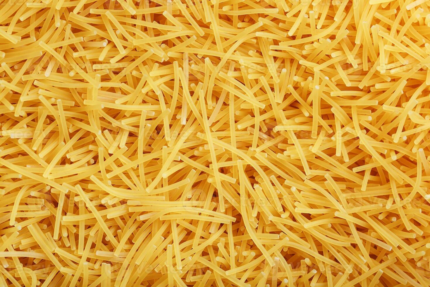 Background texture and pattern of boiled egg noodles or spaghetti pasta