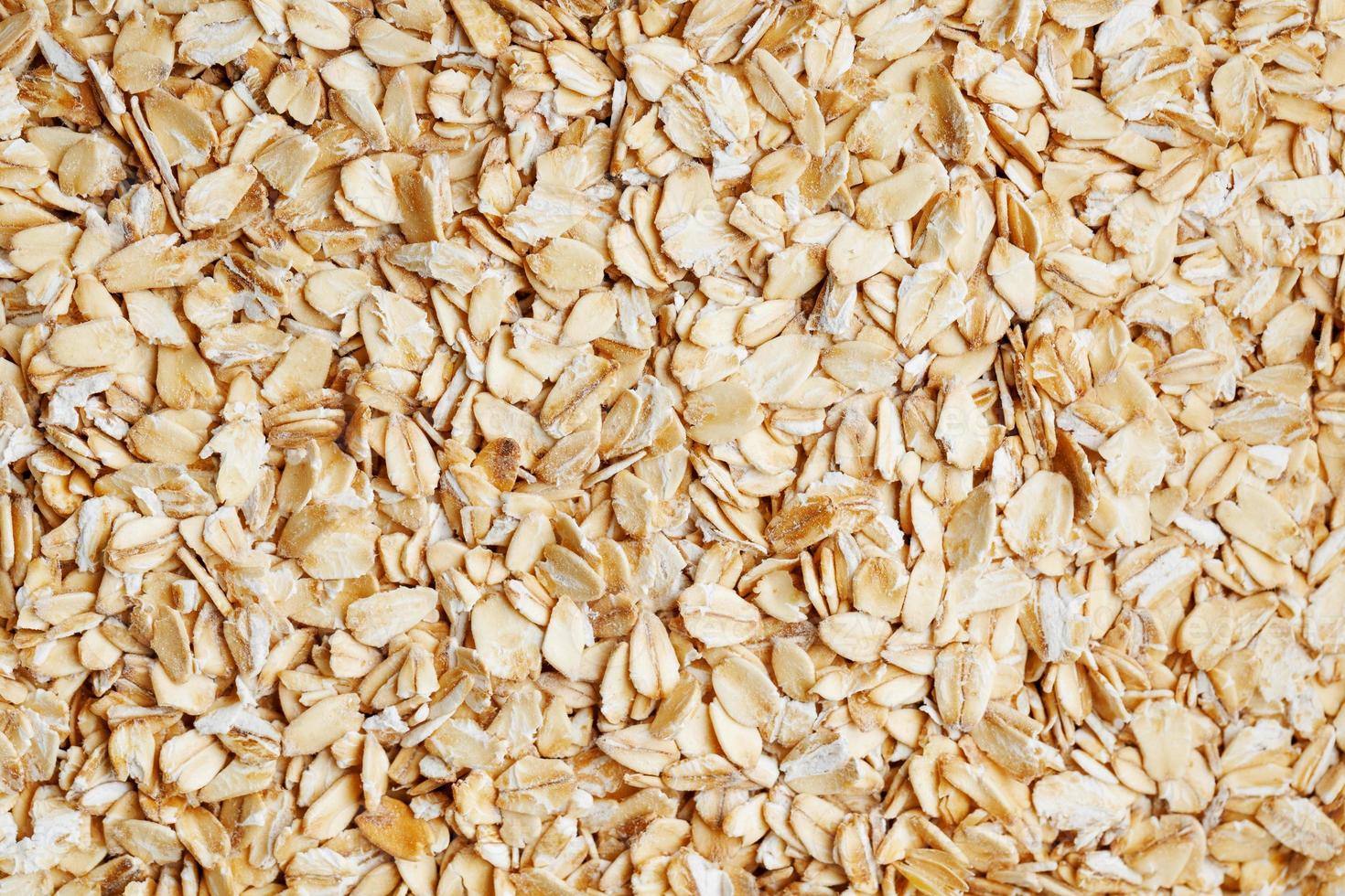 Golden cereal muesli, background and texture. Oatmeal grains. Healthy breakfast Top view. Close-up photo