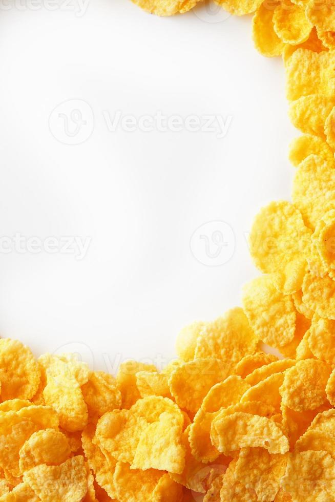 Golden Cornflakes full frame with empty round copy space in the middle as viewed from above photo