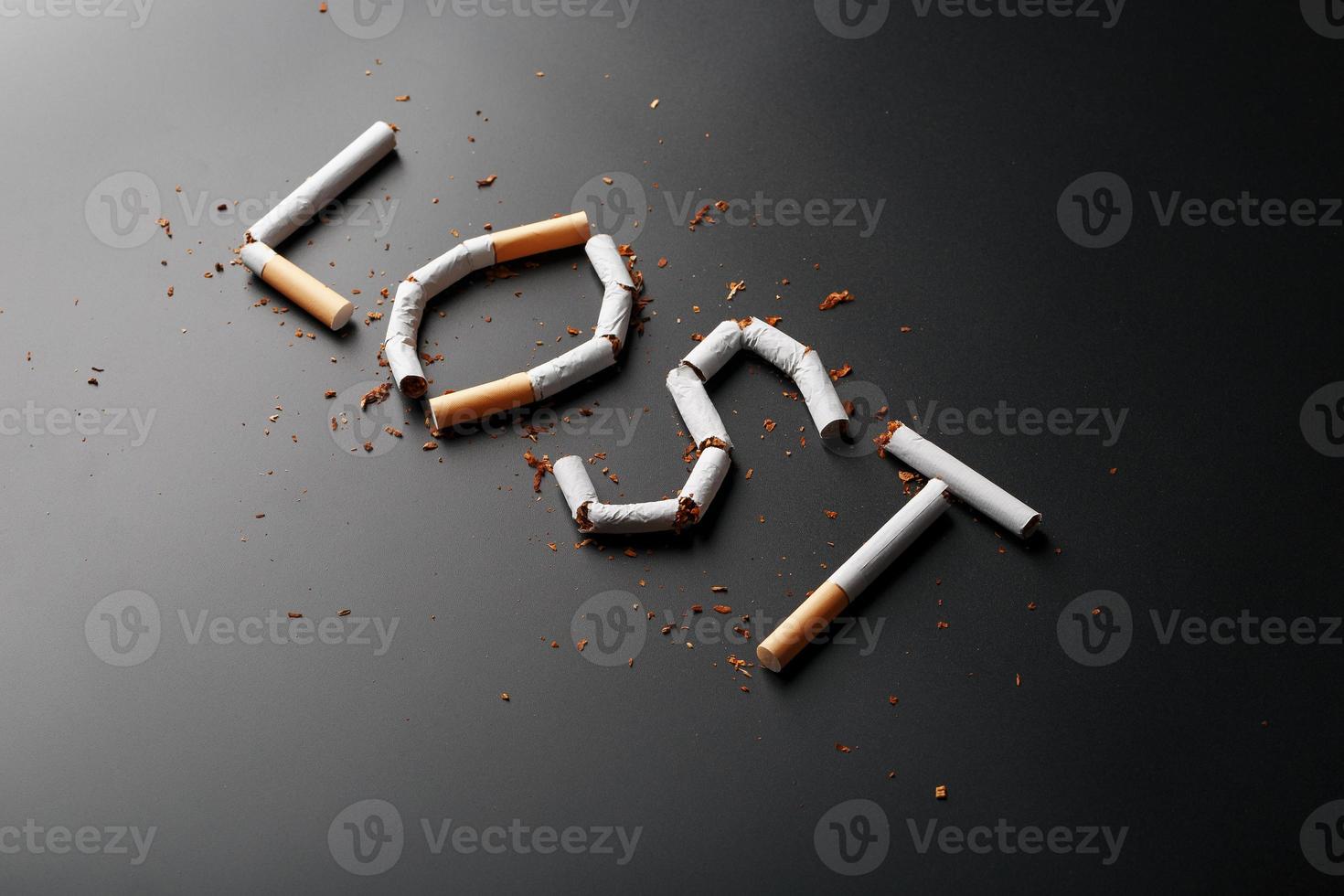 The inscription LOST from cigarettes on a black background. Stop smoking. The concept of smoking kills. Motivation inscription to quit smoking, unhealthy habit. photo