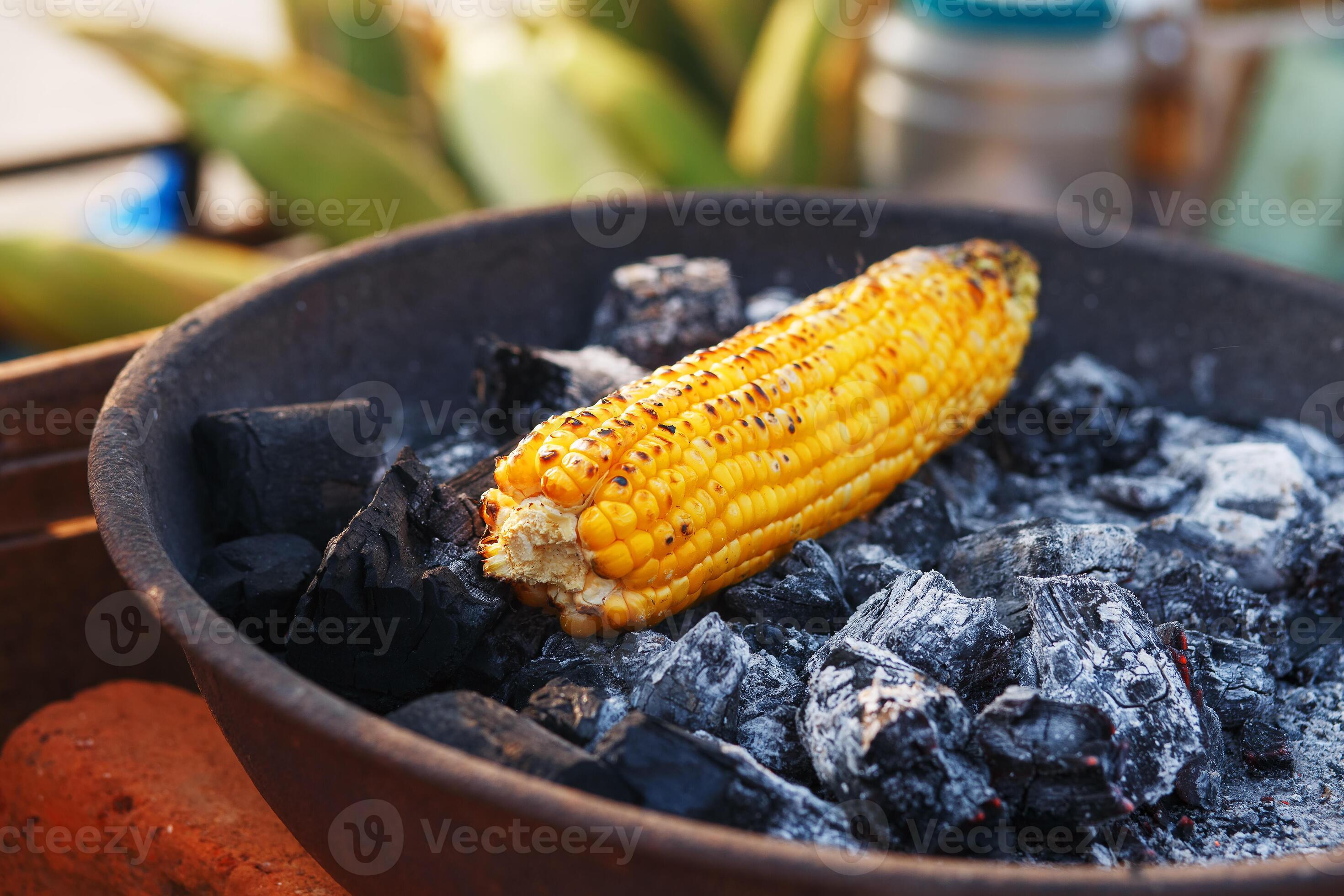 Indian Food On The Beach Fresh Corn Cobs Are Roasted On The Coals indian-food-on-the-beach-fresh-corn-cobs-are-roasted-on-the-coals