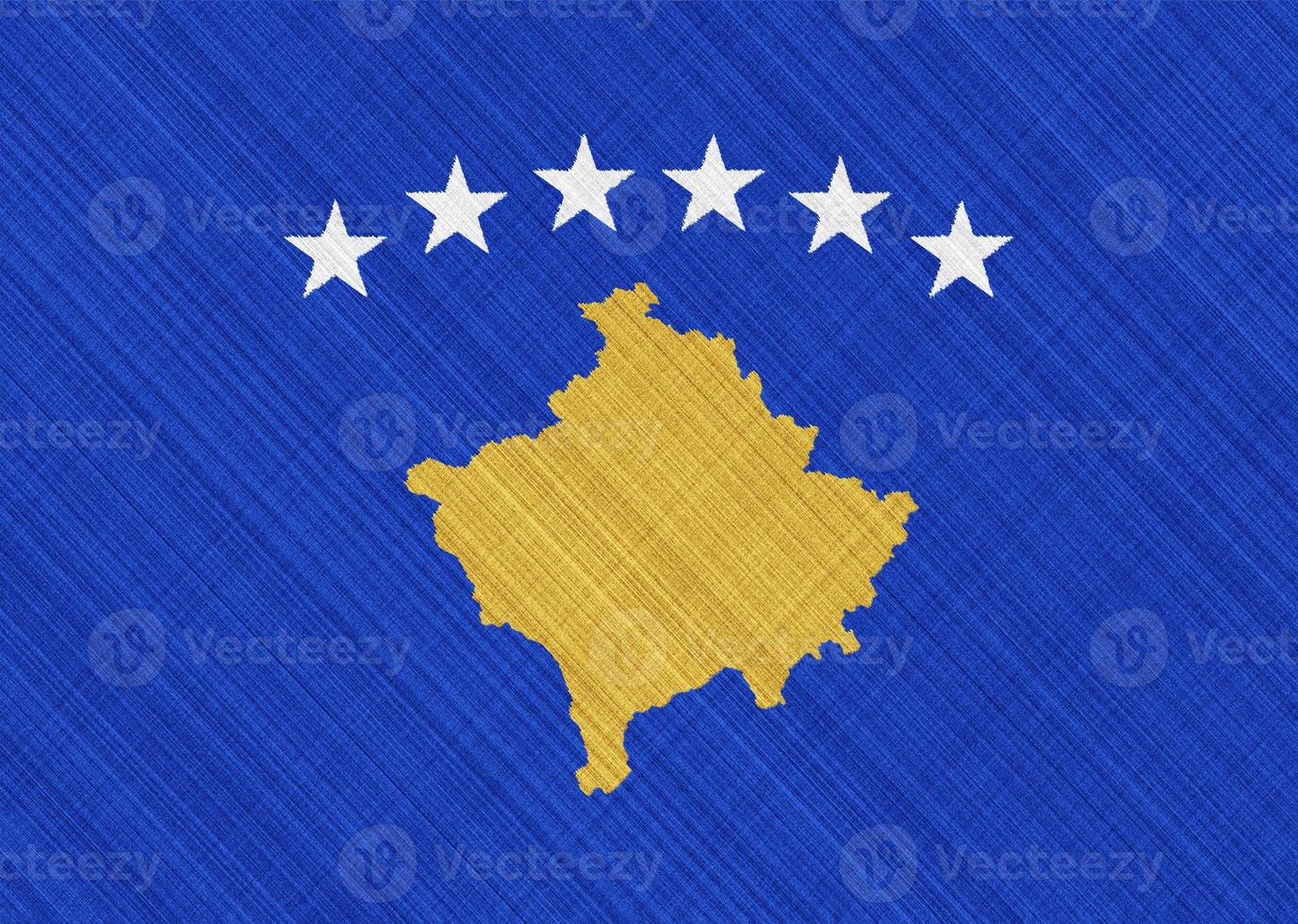 Flag of Kosovo on a textured background. Concept collage. photo