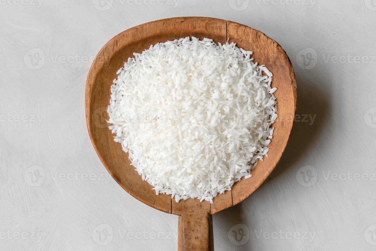 Coconut Flakes on a Wood Paddle photo