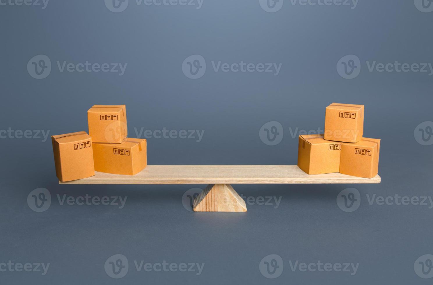Boxes on scales. Trade balance. Economic relations. Buying, selling or bartering goods. Commerce and business. Economy growth, enrichment. Trade turnover between countries photo