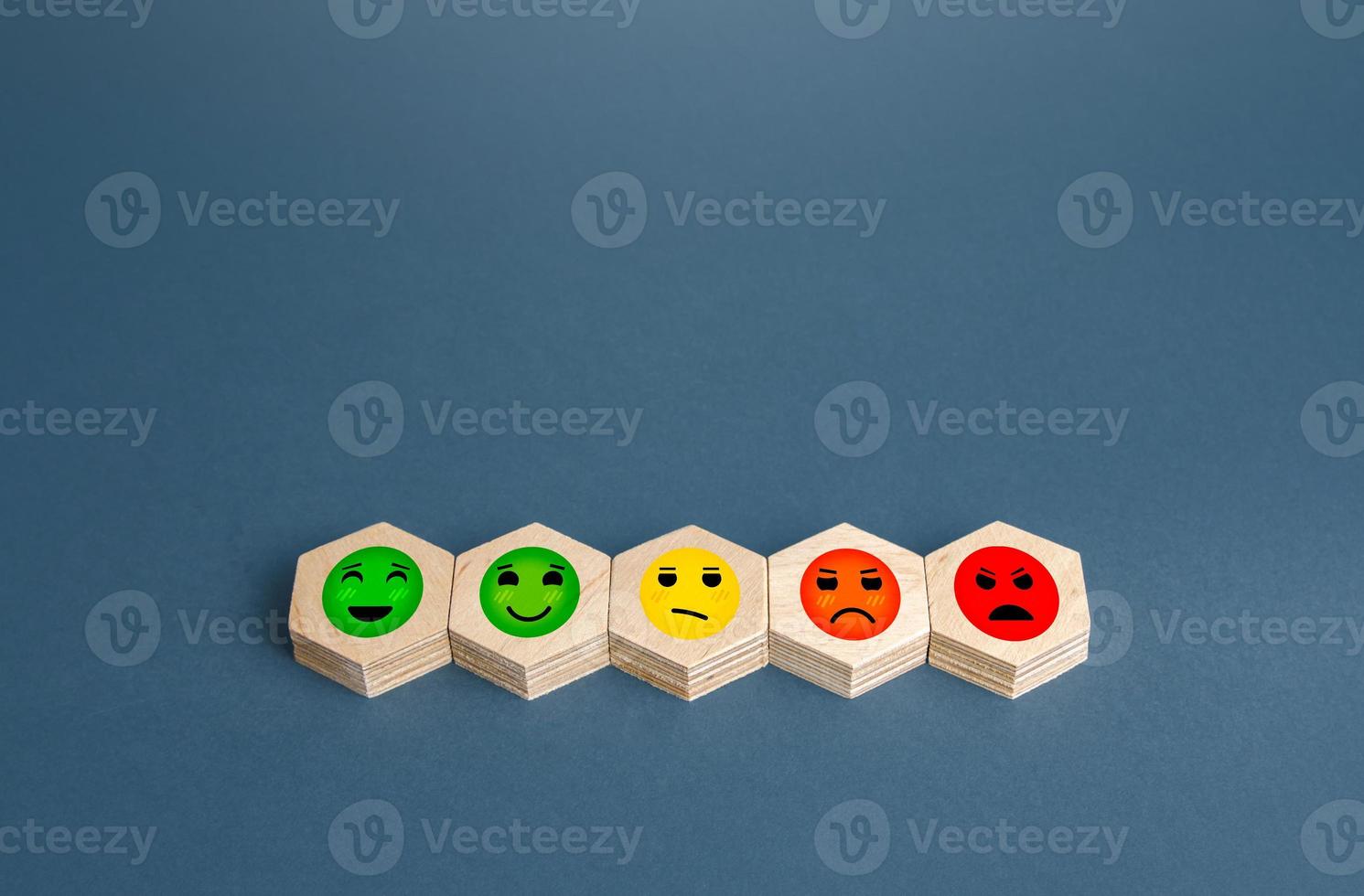 Blocks with mood faces gradations from happy to angry. Concept of rating, review. Visitor satisfaction with the services received. Quality assessment, meeting expectations. Communication and feedback. photo