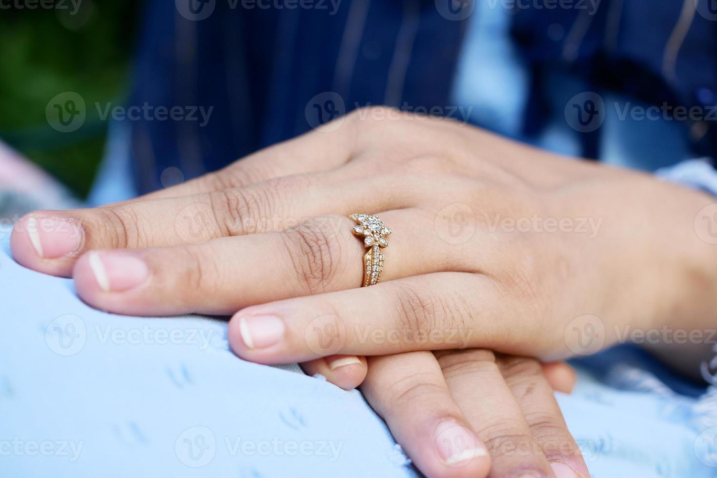 close up of women's hands with wedding ring photo