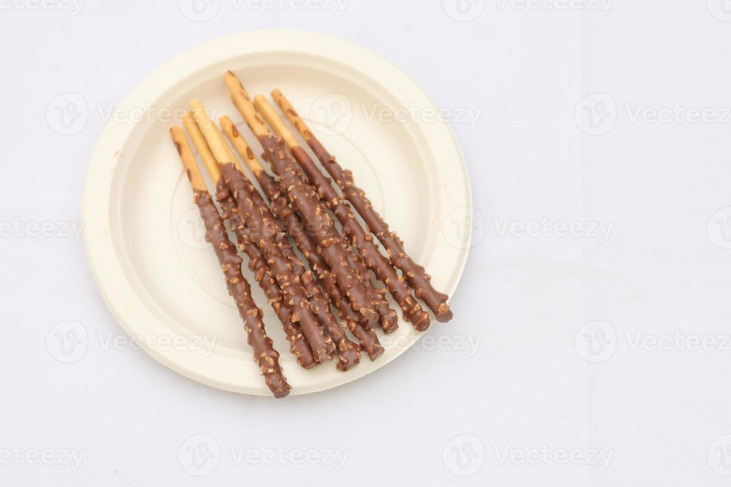 almond nut dark chocolate stick on table photo