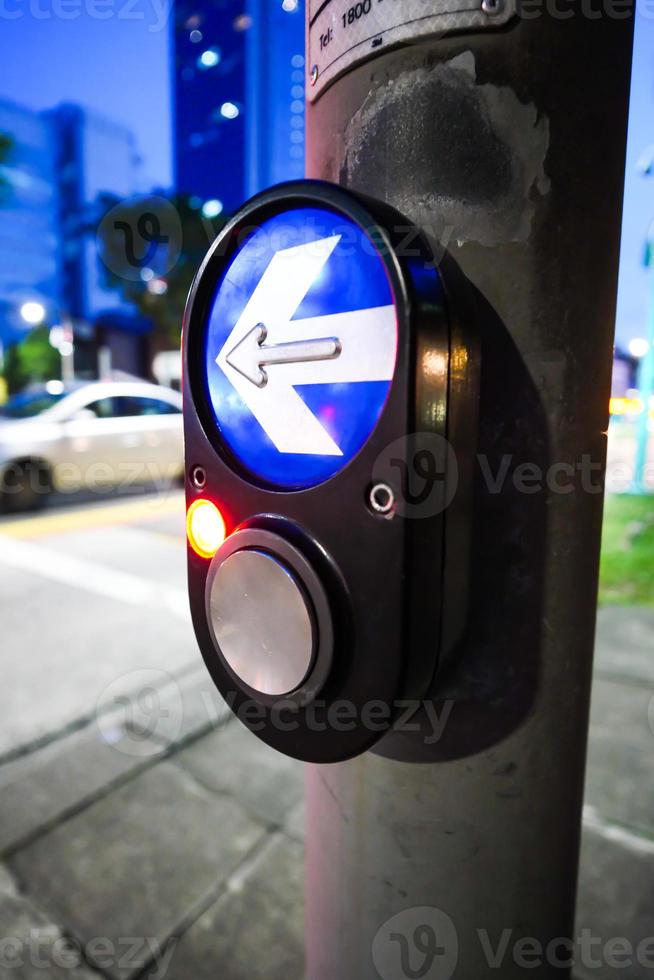 close up of crossing signal button in singapore photo