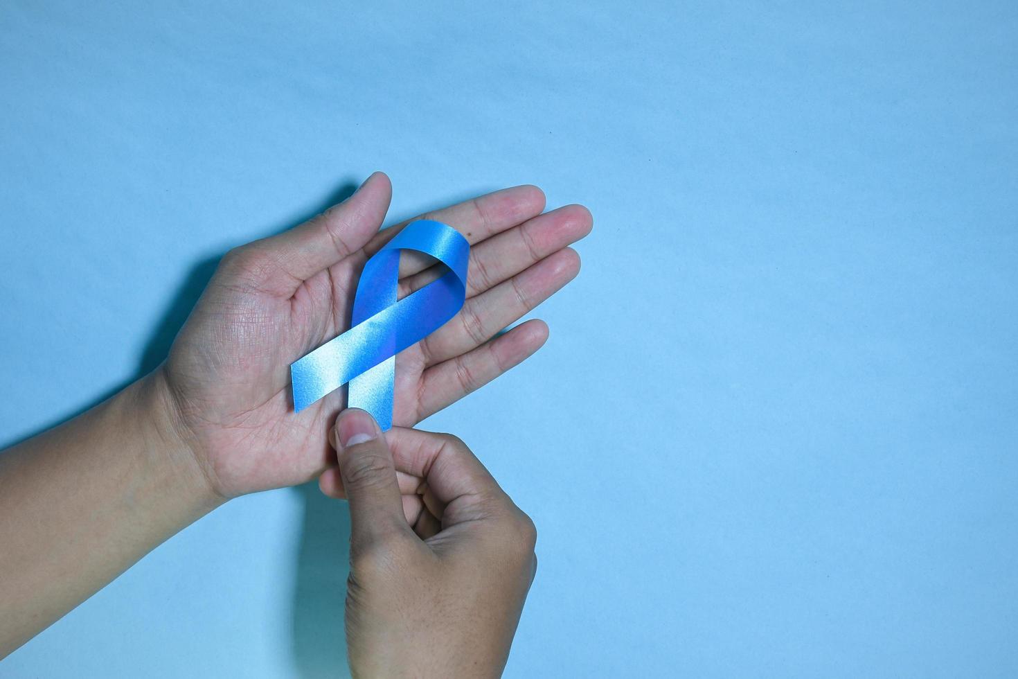 Blue ribbons on blue background with the word world diabetes day, November Men health awareness, November Blue. diabetes awareness photo