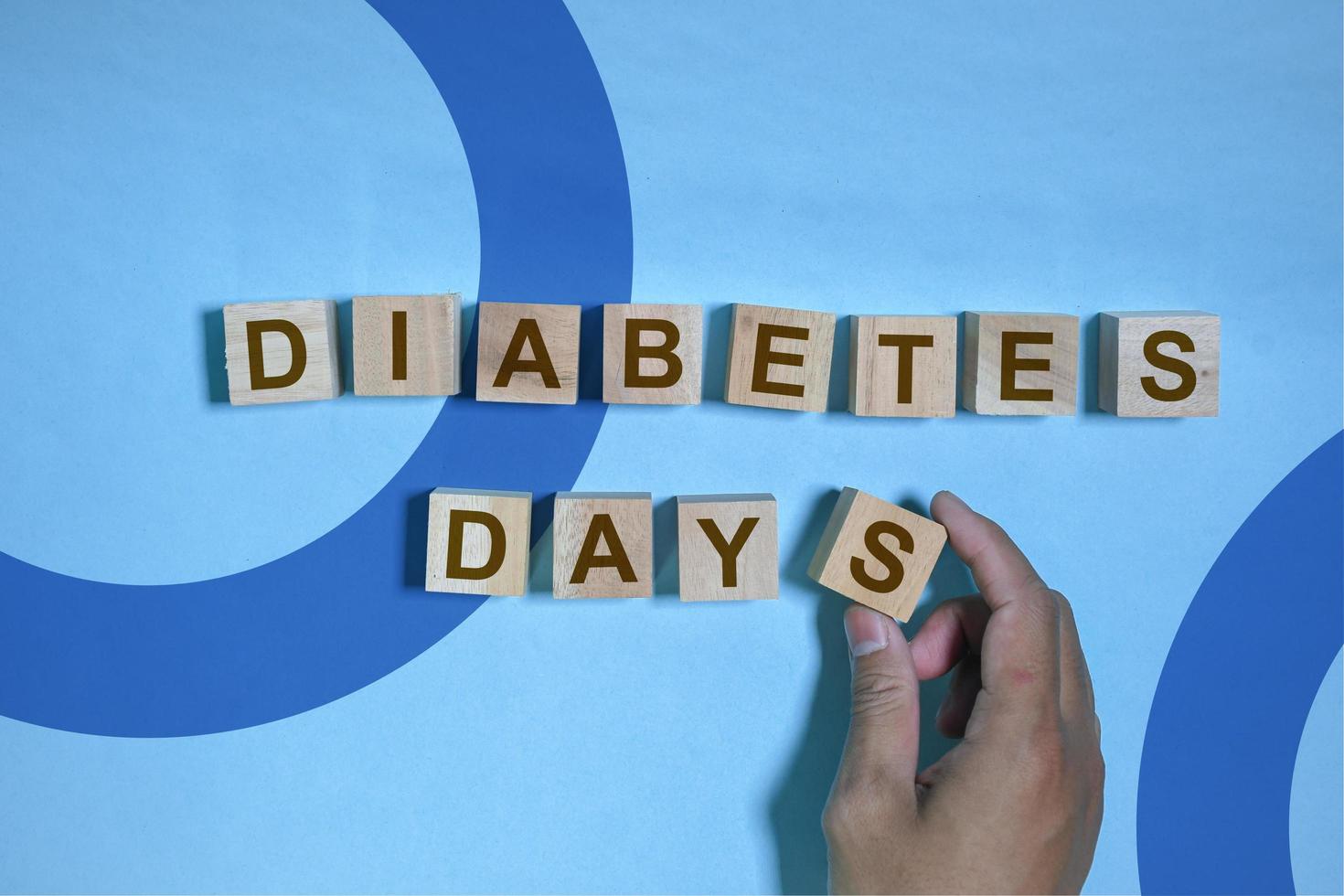 Word blocks with the words diabetes day on blue background, health awareness, world diabetes days, 14 november photo