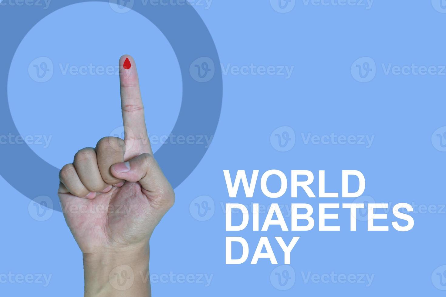Top view inscription world diabetes day and hand gesture with red blood drop in man hands isolated on a blue background. World diabetes day, 14 november. Copy space., Health Awareness photo
