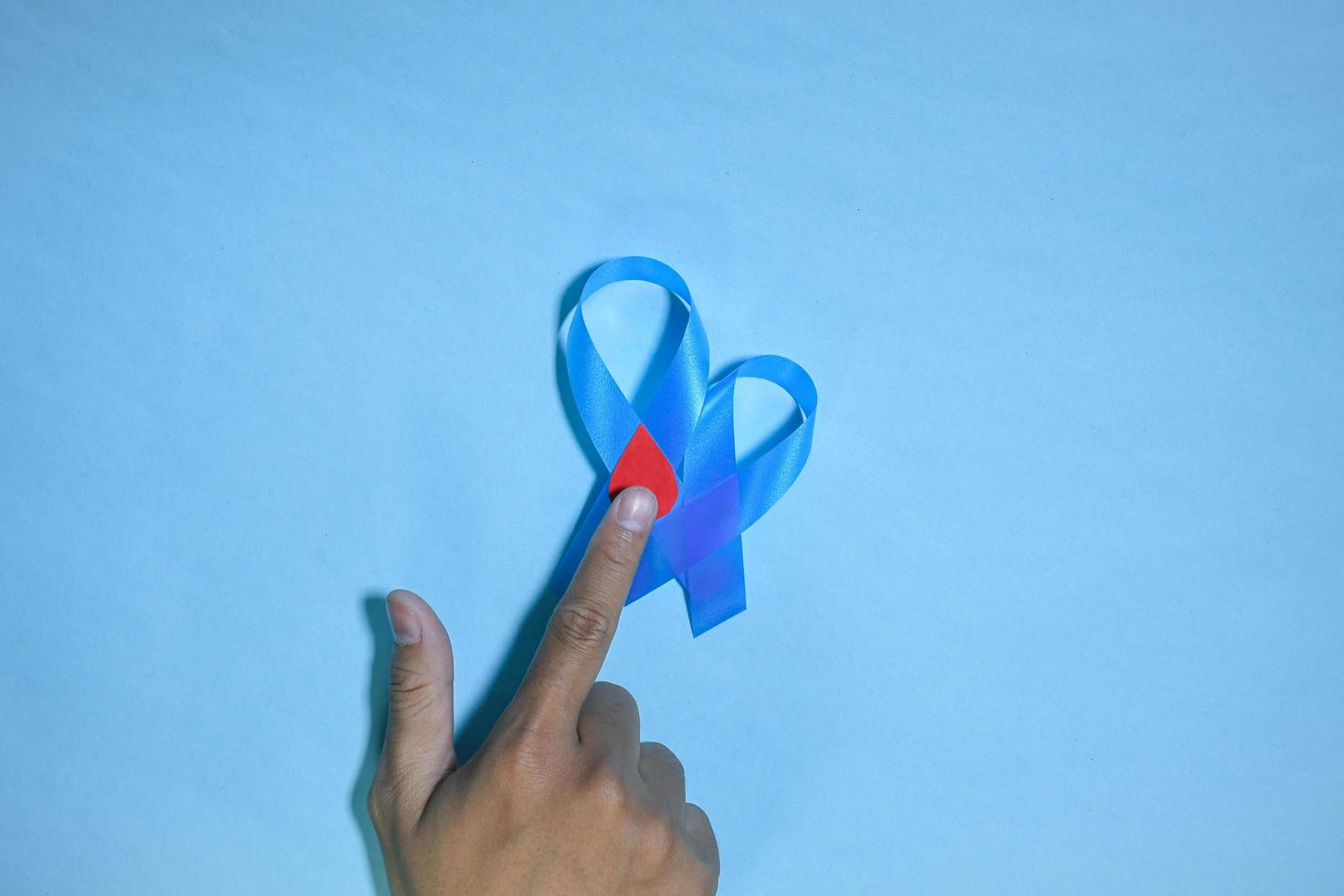 Blue ribbons on blue background with the word world diabetes day, November Men health awareness, November Blue. diabetes awareness photo