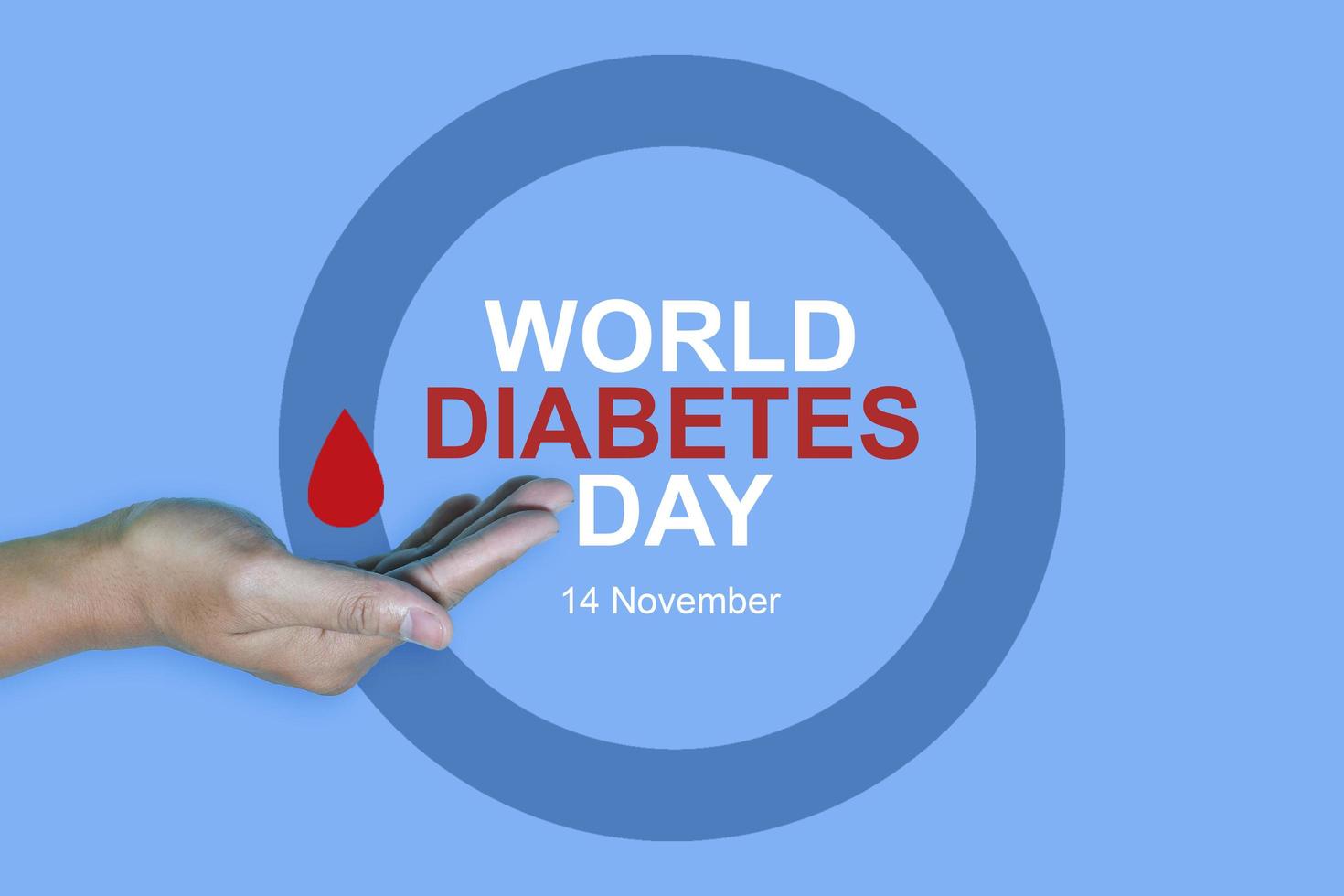 Top view inscription world diabetes day and hand gesture with red blood drop in man hands isolated on a blue background. World diabetes day, 14 november. Copy space, Health Awareness photo