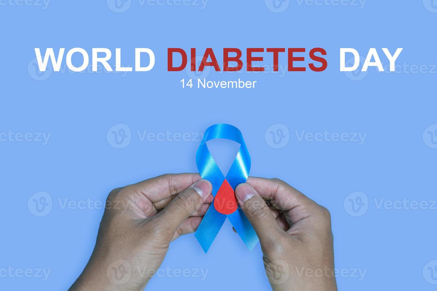 Blue ribbons on blue background with the word world diabetes day, November Men health awareness, November Blue. diabetes awareness photo