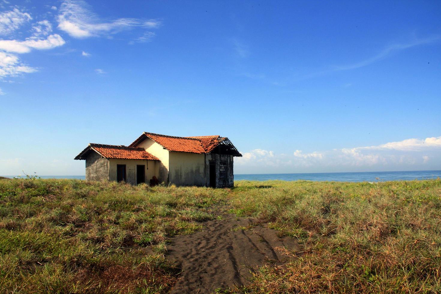 Sangatta, East Kutai, East Kalimantan, Indonesia, 2022 - Abandone house on the coast. Purworejo, Central Java, Indonesia. photo