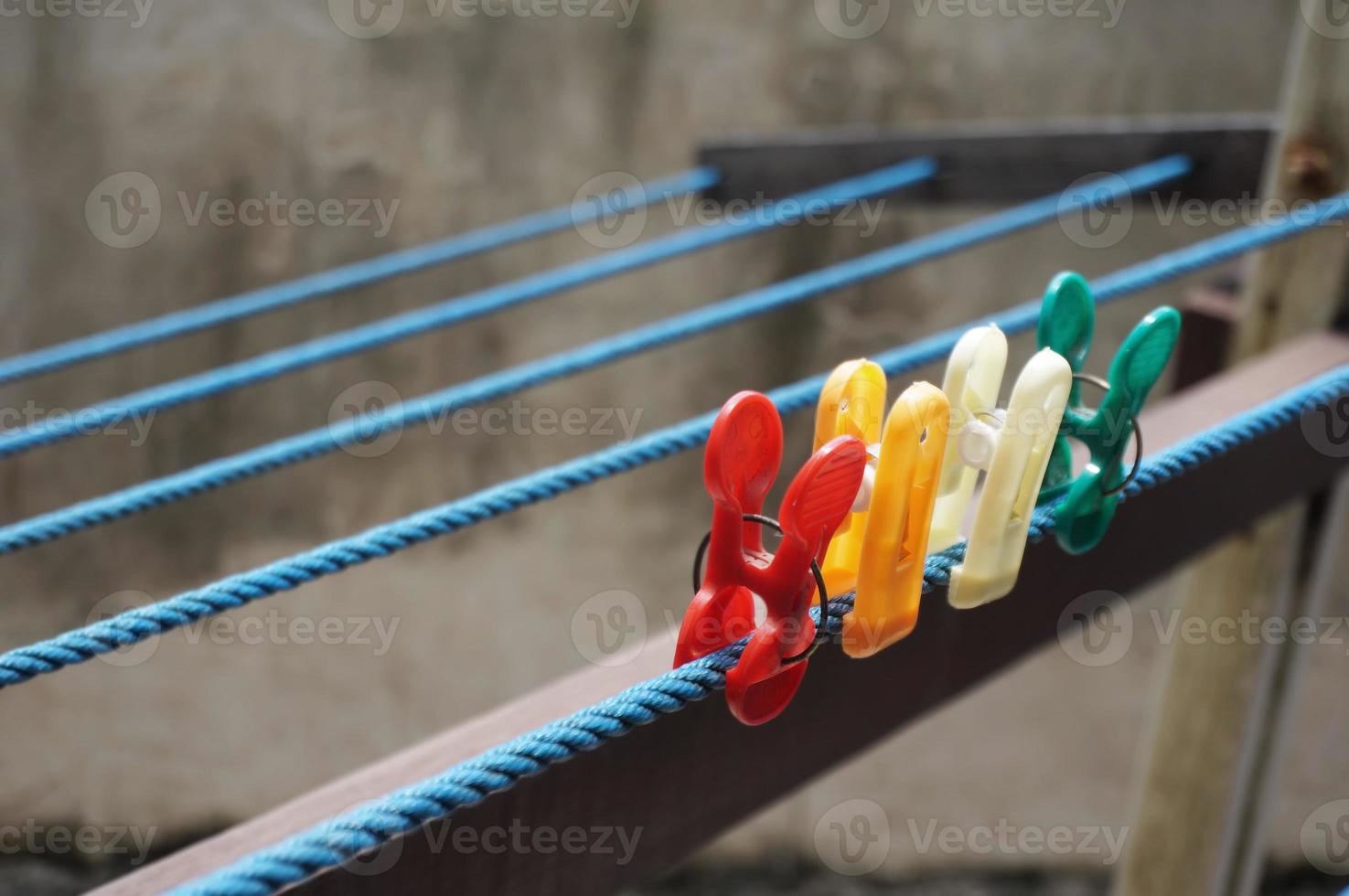 Colorful clothespin clothespins on the hangers. Plastic clothespins in different colors. photo