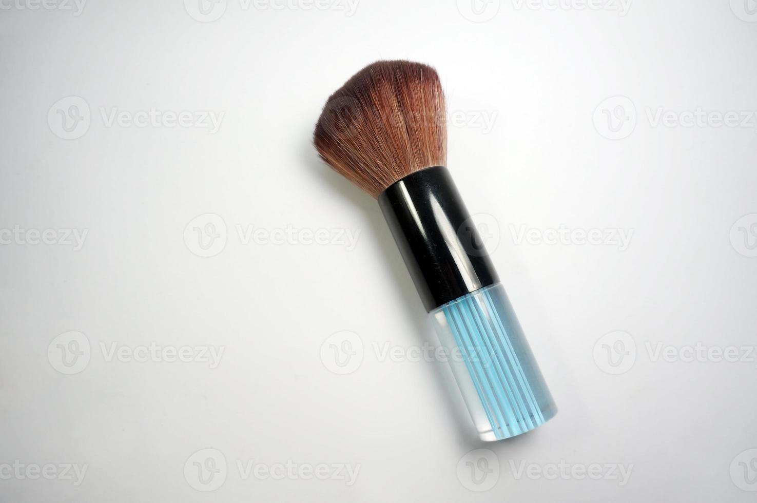 Cosmetic brush makeup isolated on white background photo