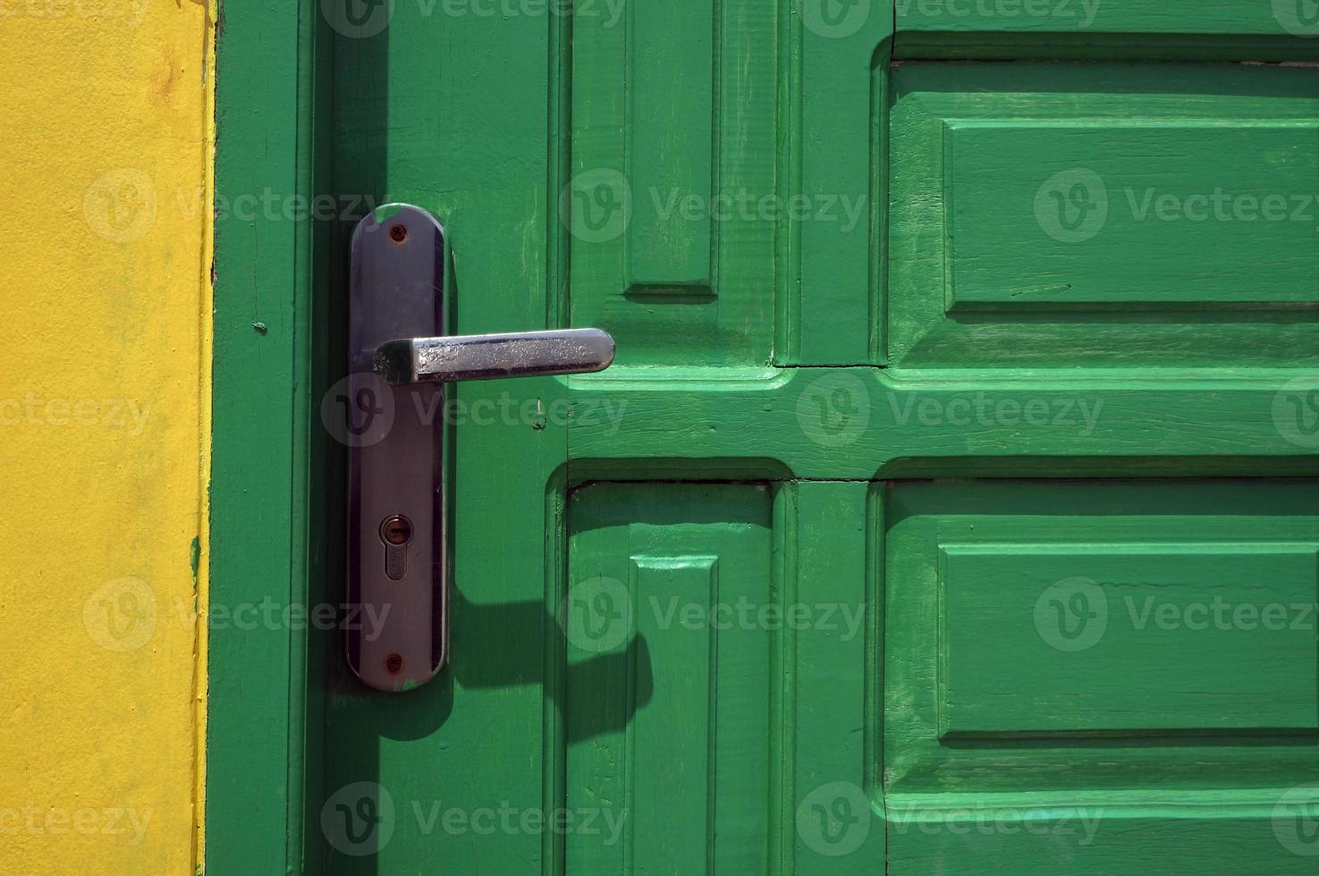 light green door with metal handle photo