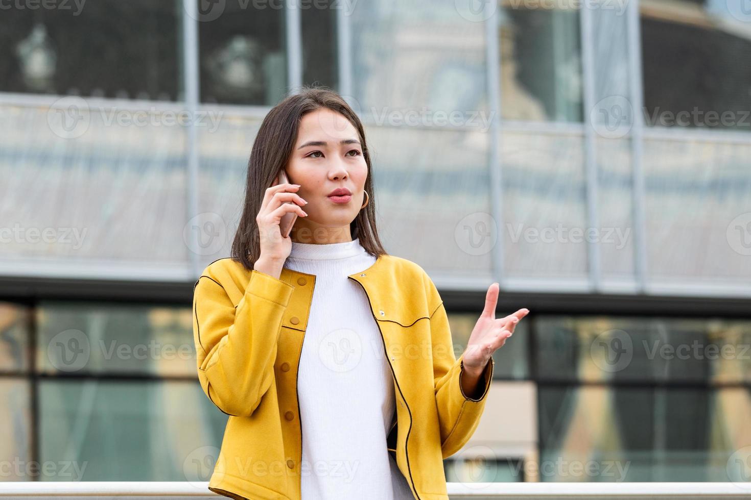 Businesswoman in formal wear having trouble with contracts talking on the phone. Businesswoman angry abount about paperwork failure at workplace, executives having conflict photo