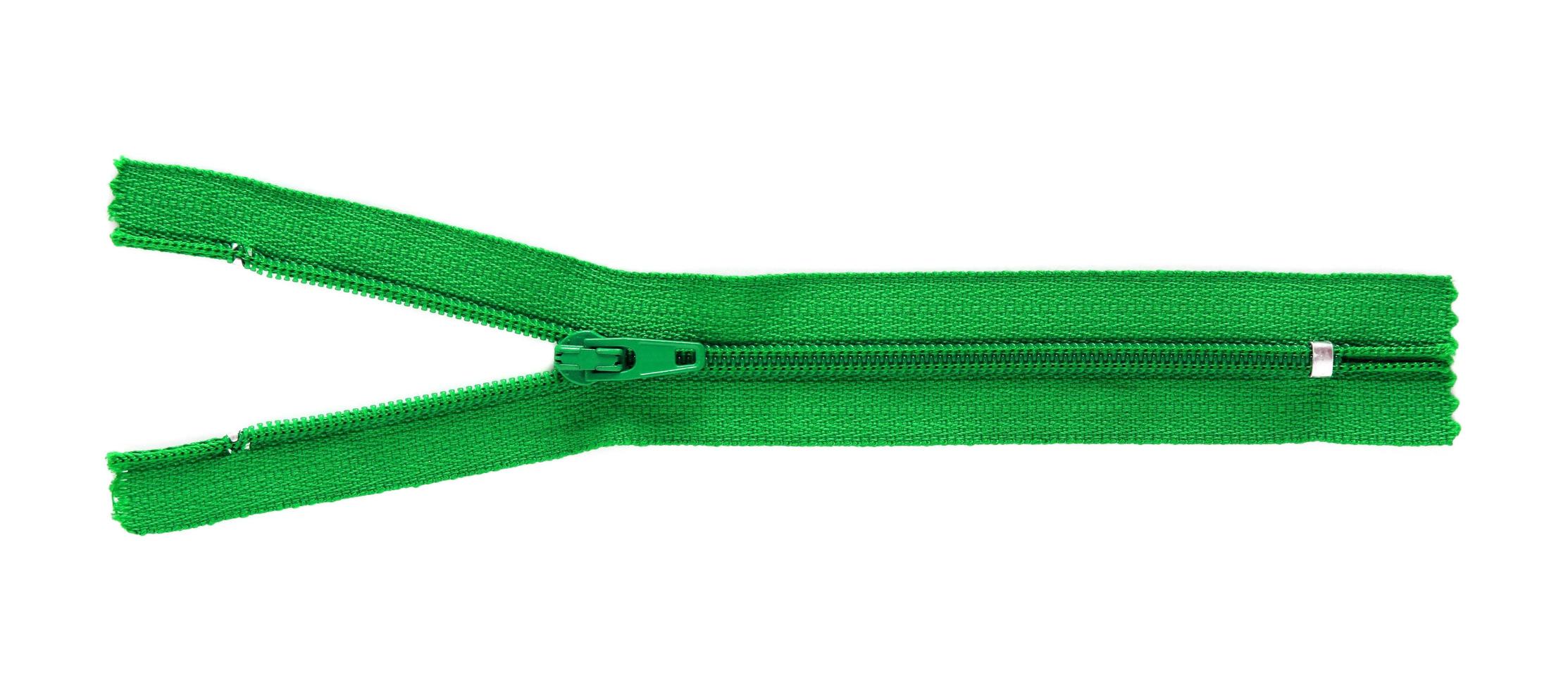 green zipper isolated on white photo