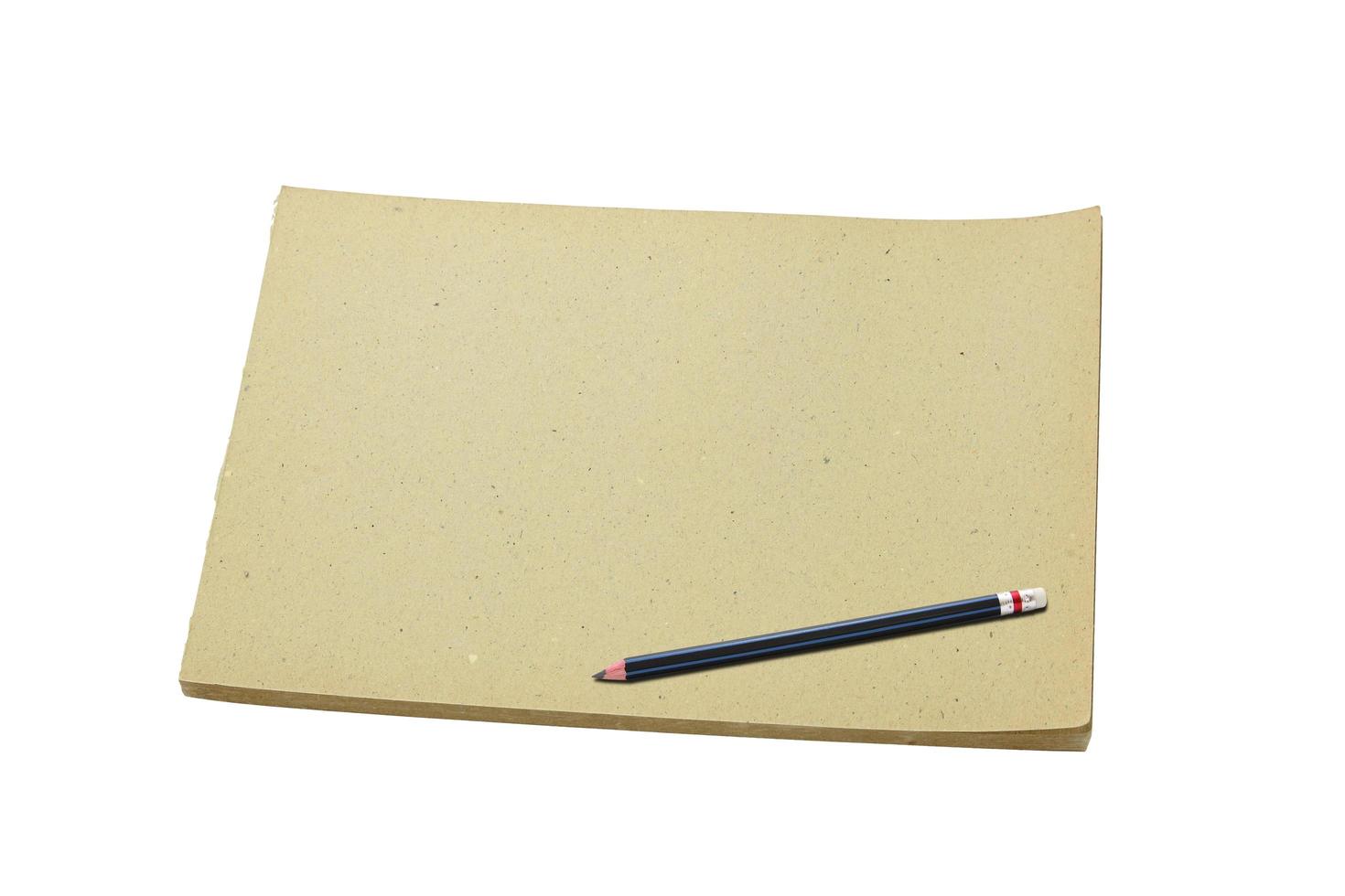 Pencil and old blank sketch book isolated on white background photo