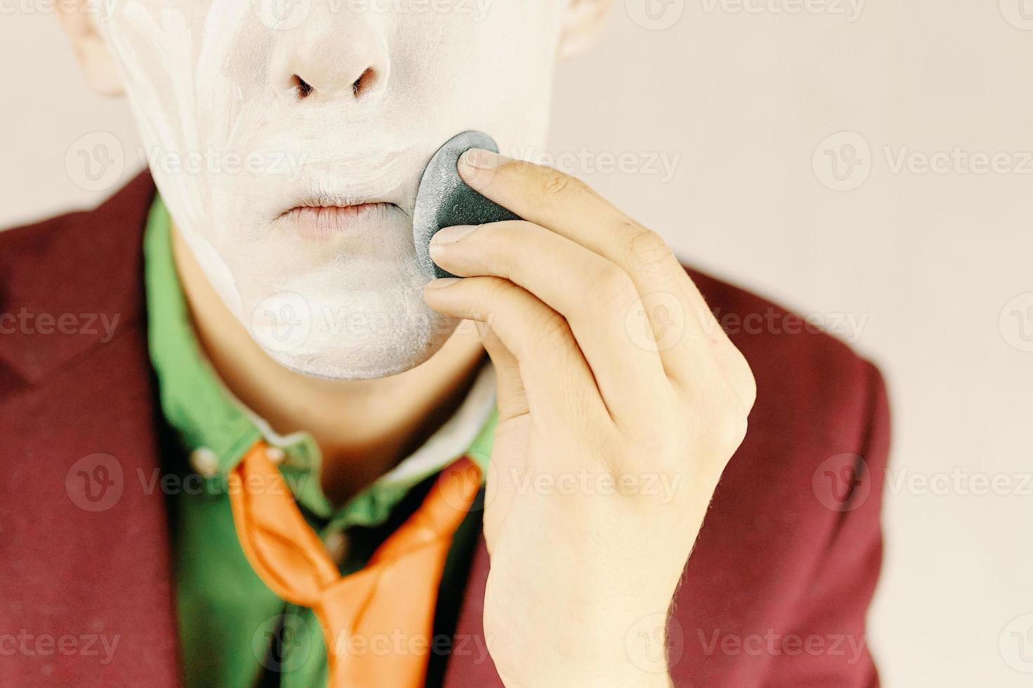 Man apply makeup. photo