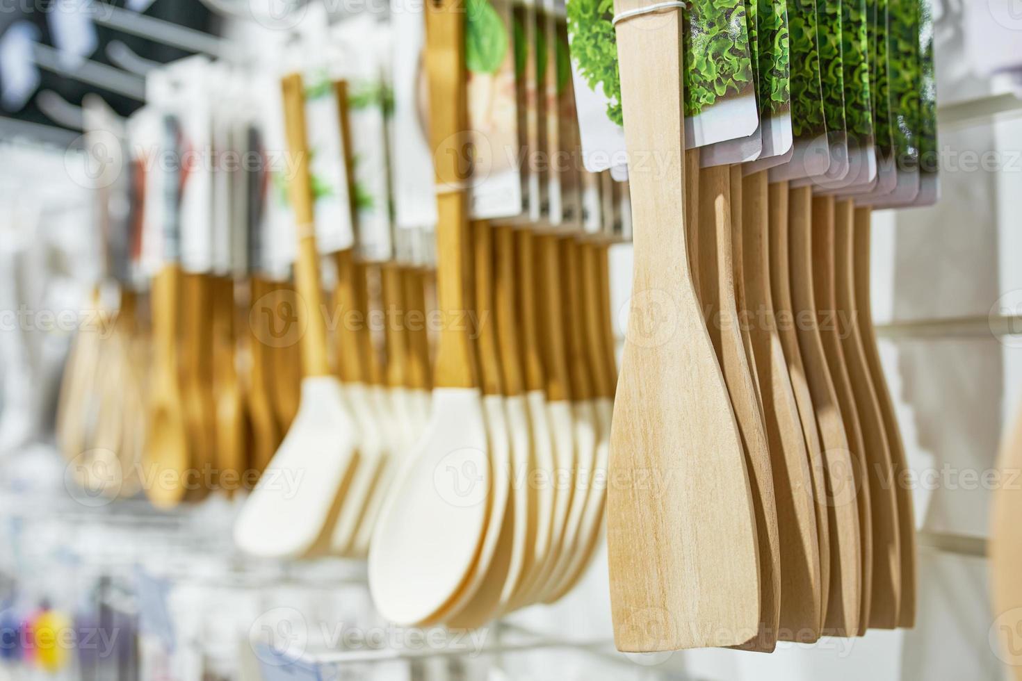 Shop window with wooden kitchen utensils. photo