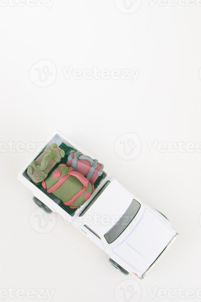 Car toy model with suitcases. photo