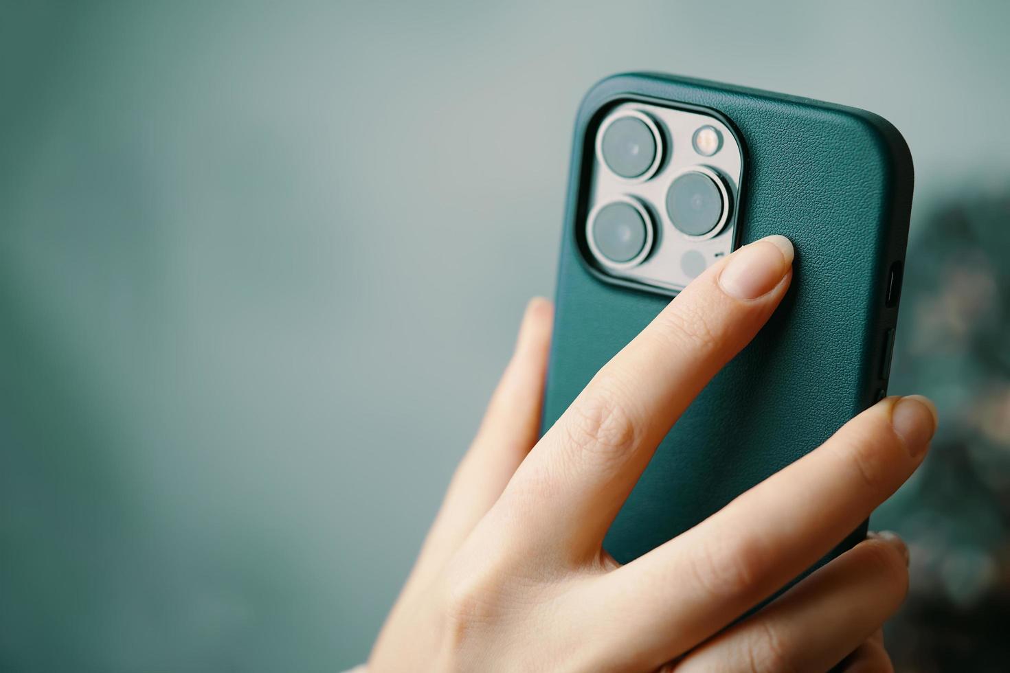 Women's hands with iPhone 13 pro. photo