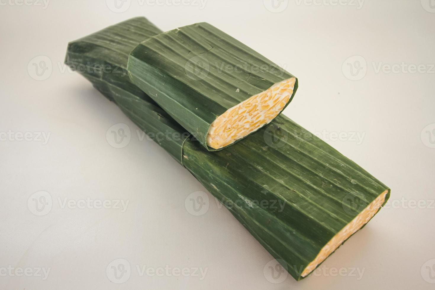 Tempeh or Tempe is Indonesian traditional food made from fermented soybeans. They are usually wrapped in banana leaves photo