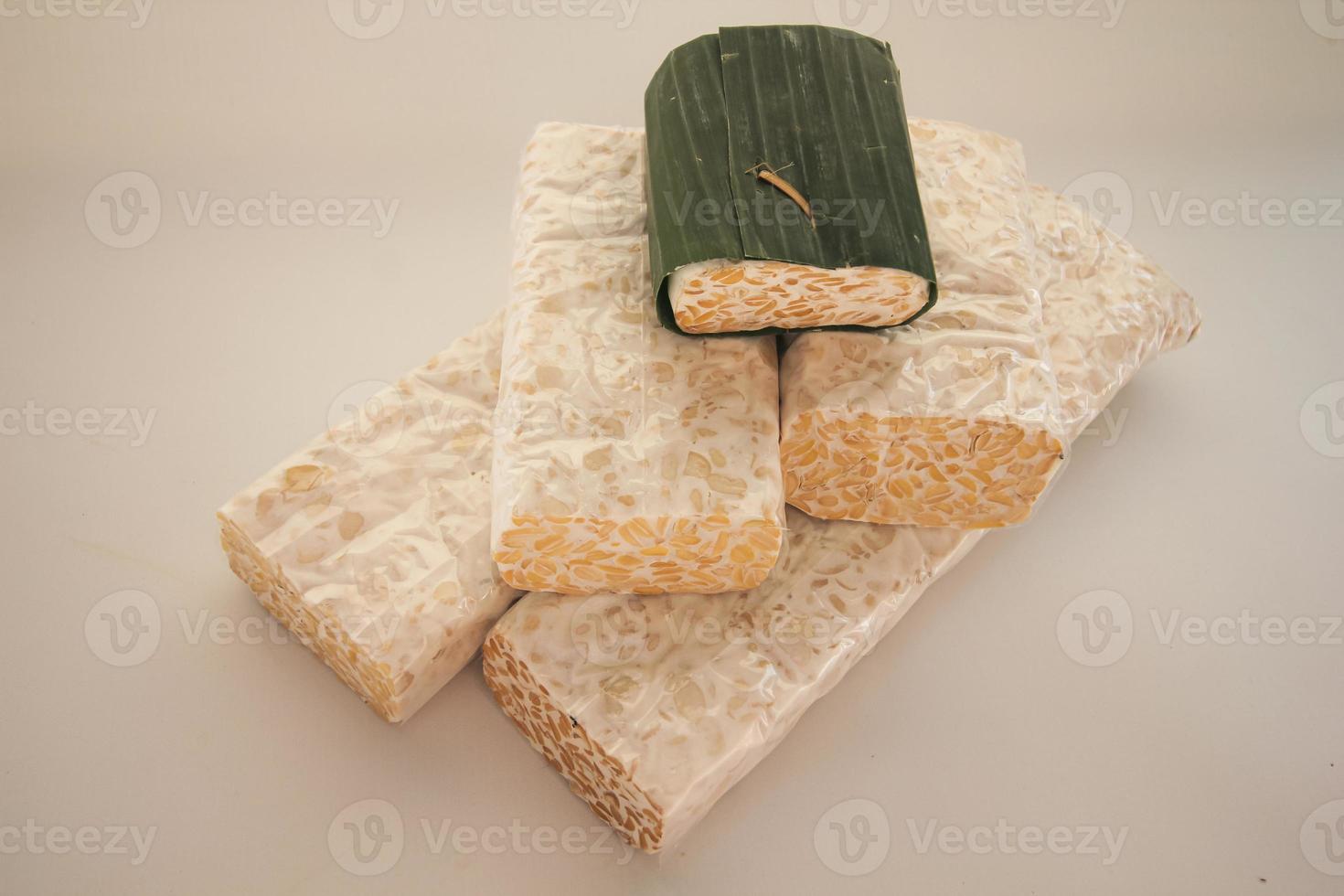 Tempeh or Tempe is Indonesian traditional food made from fermented soybeans. They are usually wrapped in banana leaves photo