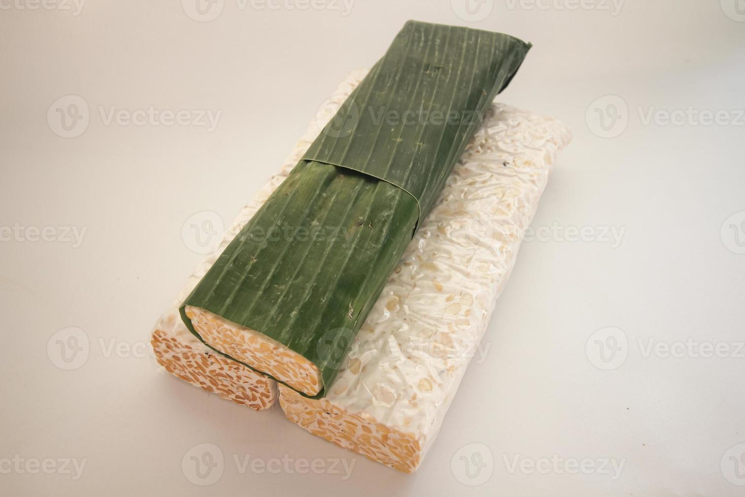 Tempeh Or Tempe is Indonesian traditional food made from fermented soybeans. They are usually wrapped in banana leaves photo