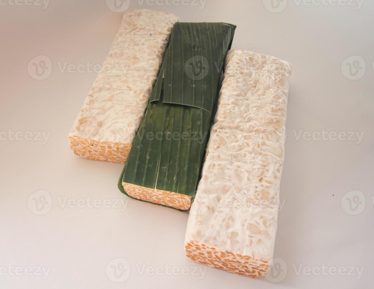 Tempeh Or Tempe is Indonesian traditional food made from fermented soybeans. They are usually wrapped in banana leaves photo