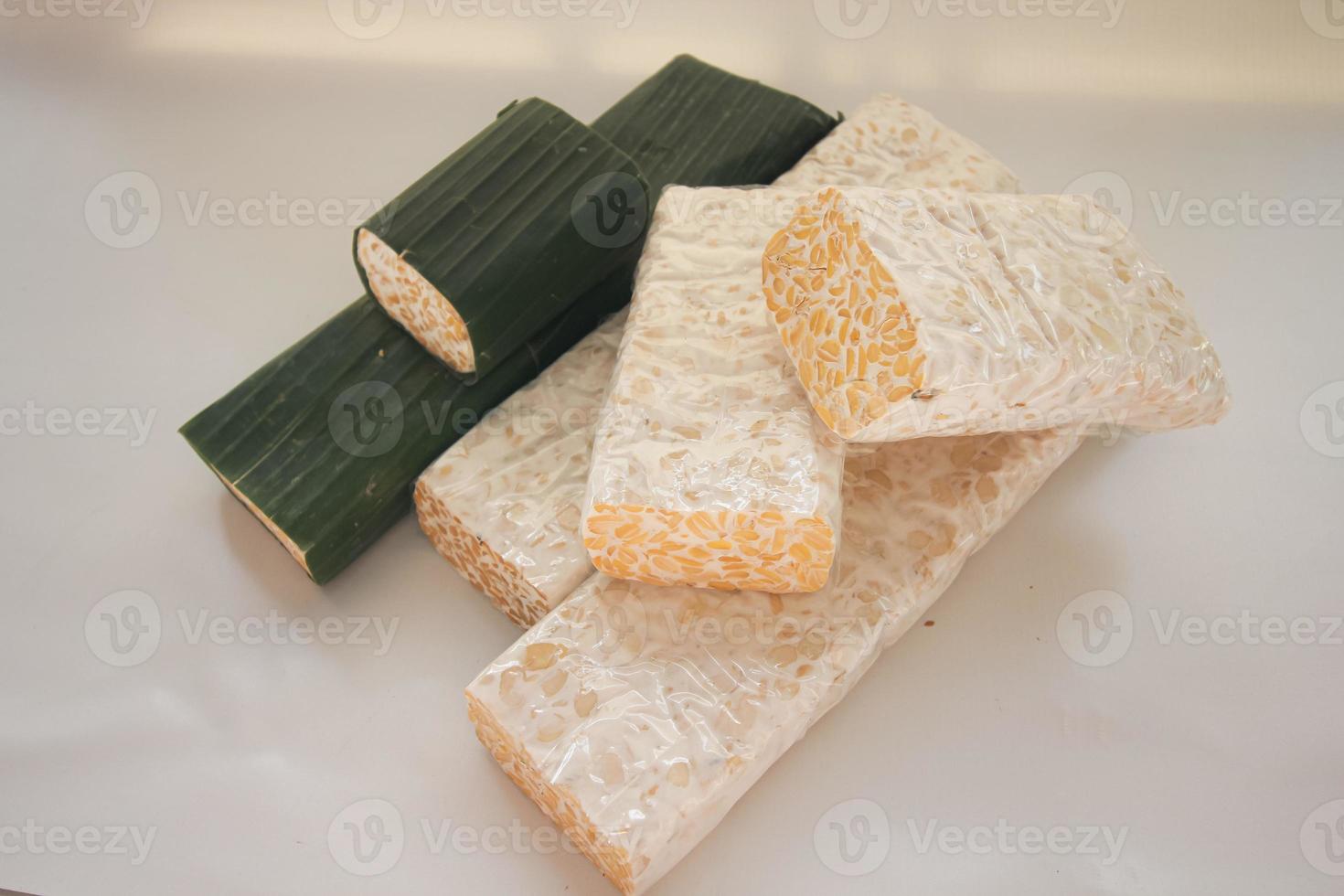 Tempeh Or Tempe is Indonesian traditional food made from fermented soybeans. They are usually wrapped in banana leaves photo