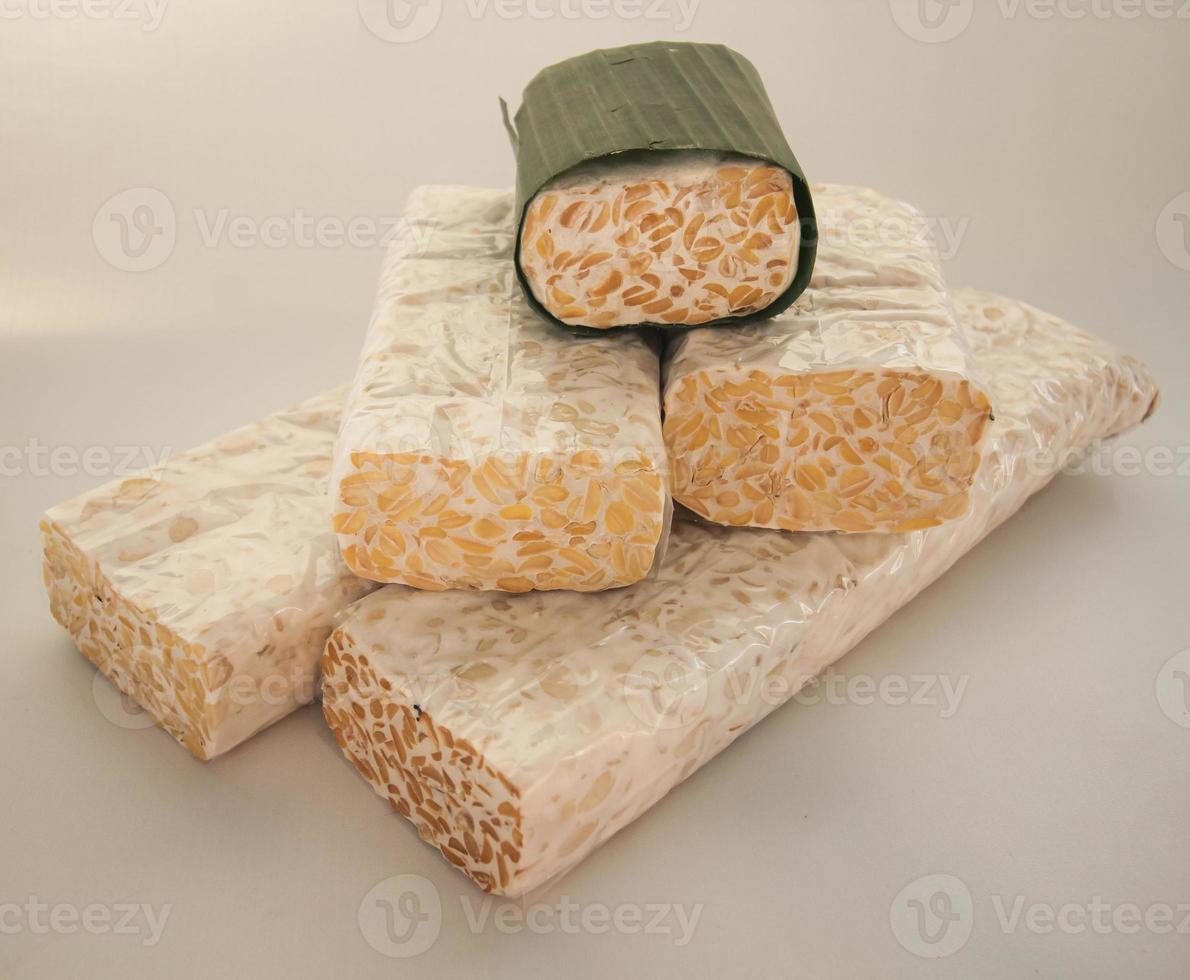 Tempeh or Tempe is Indonesian traditional food made from fermented soybeans. They are usually wrapped in banana leaves photo