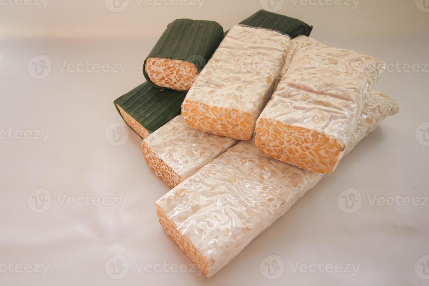 Tempeh Or Tempe is Indonesian traditional food made from fermented soybeans. They are usually wrapped in banana leaves photo