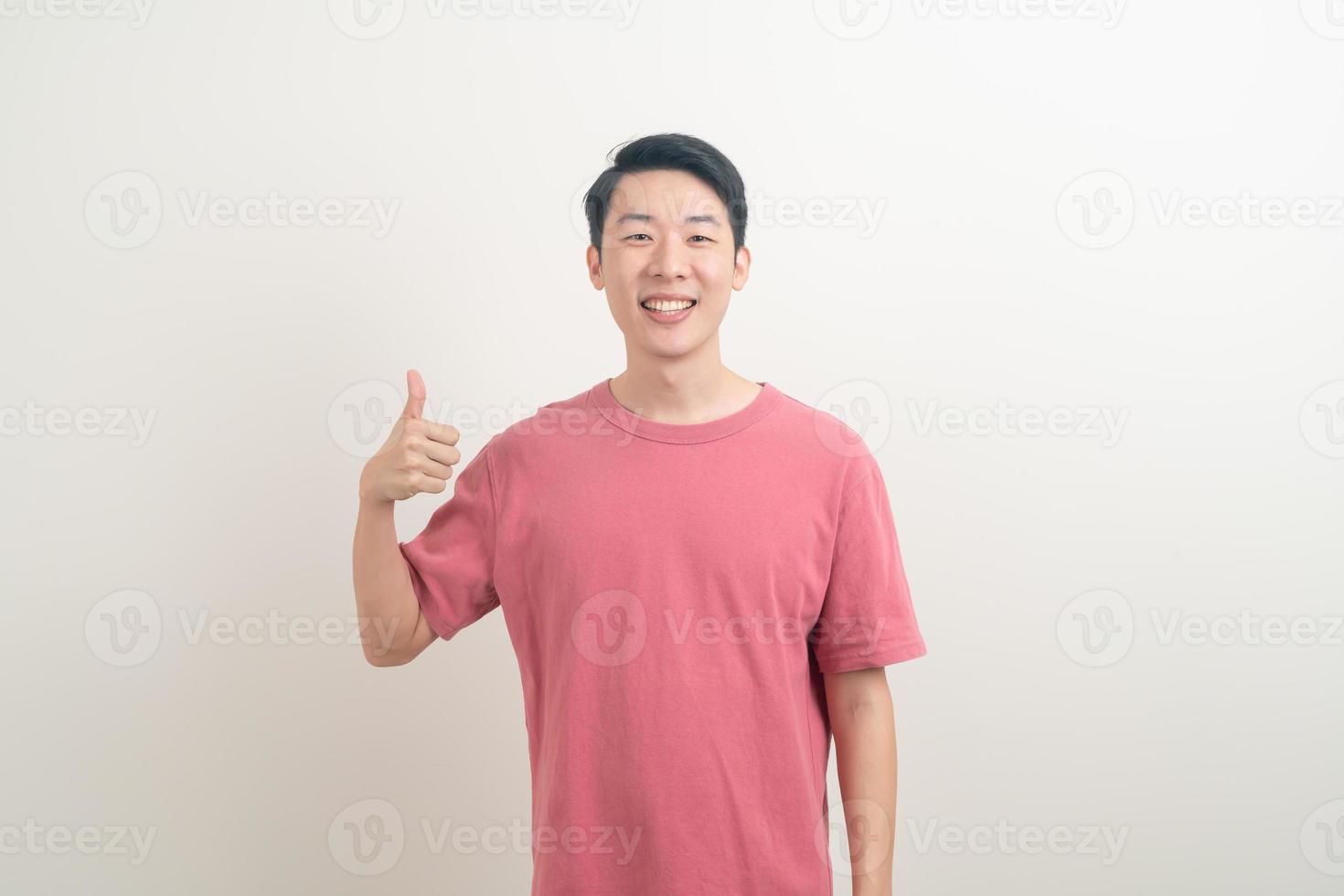 young Asian man thumbs up or ok hand sign photo