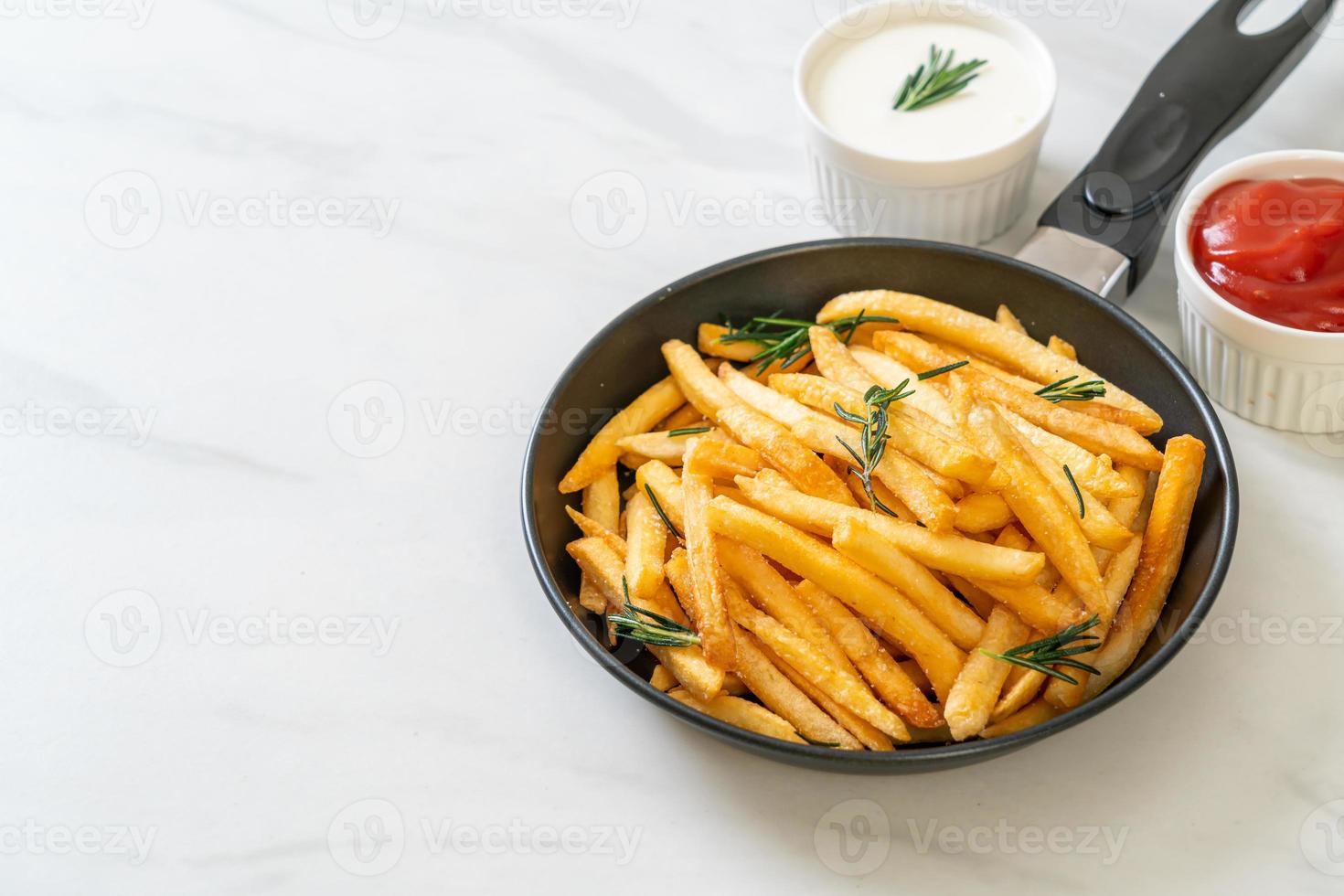 French fries with sour cream and ketchup photo