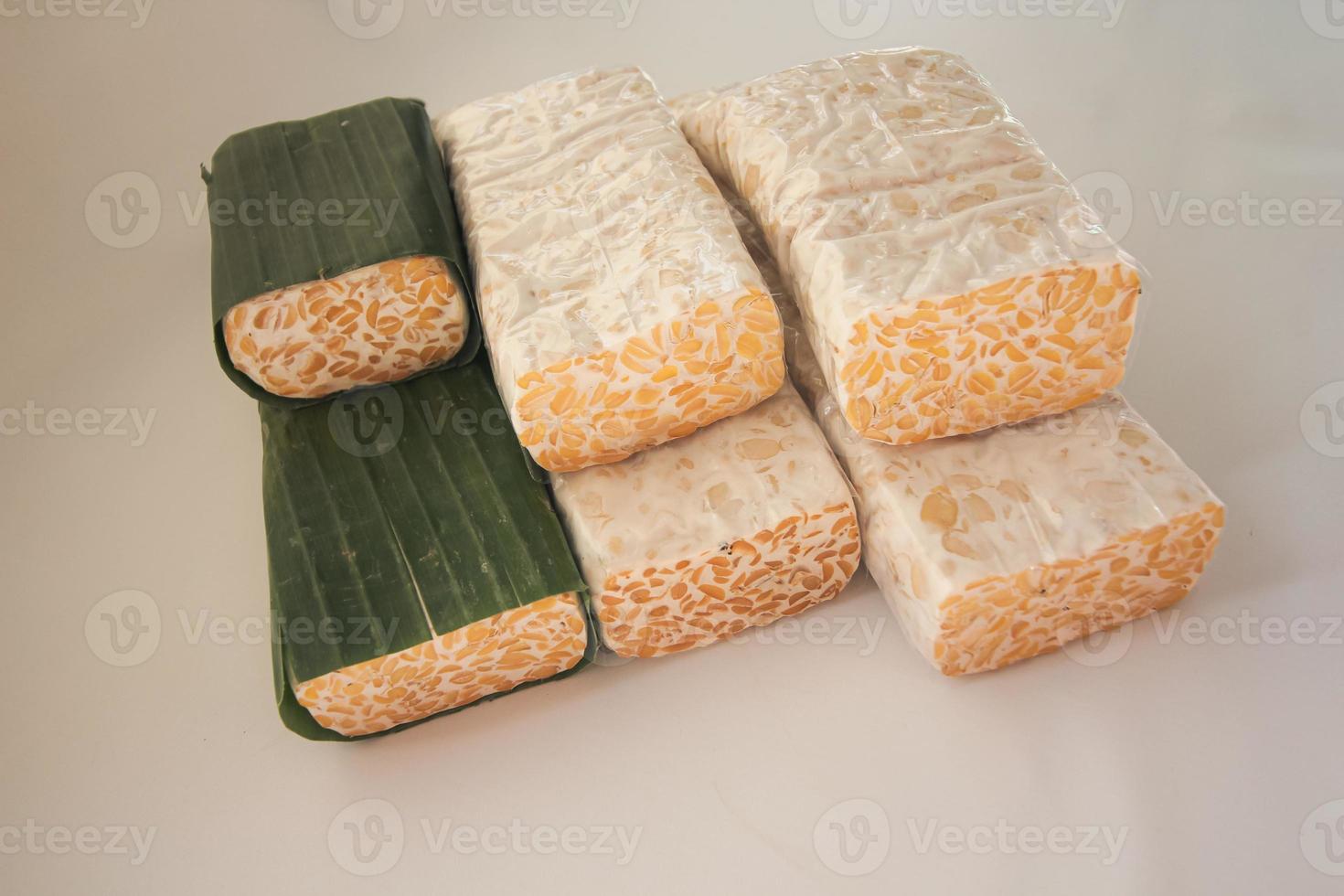 Tempeh Or Tempe is Indonesian traditional food made from fermented soybeans. They are usually wrapped in banana leaves photo