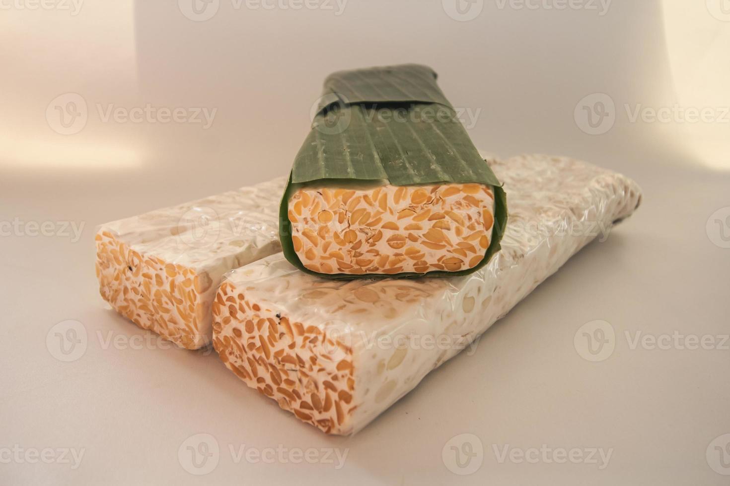 Tempeh Or Tempe is Indonesian traditional food made from fermented soybeans. They are usually wrapped in banana leaves photo
