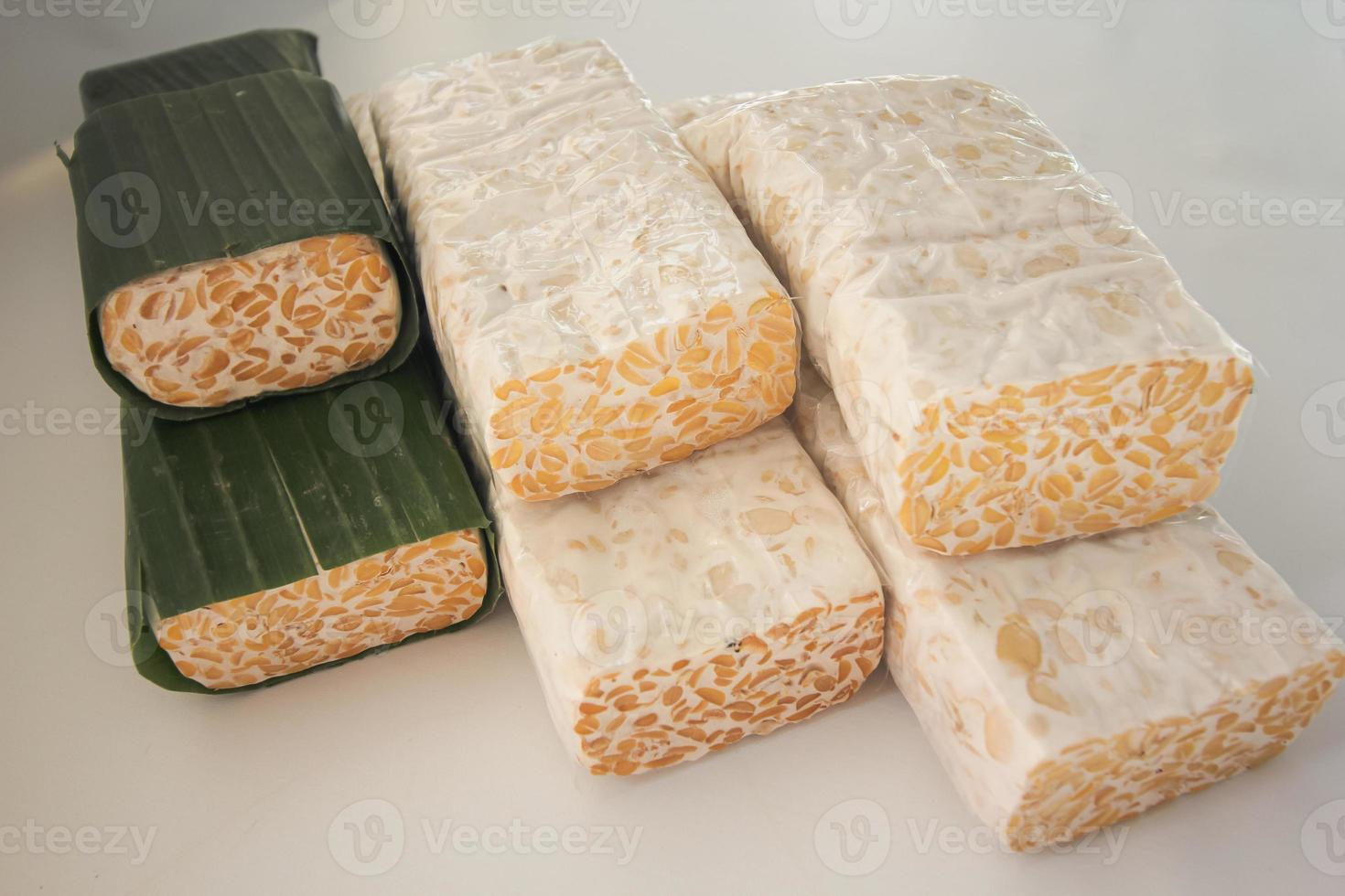 Tempeh Or Tempe is Indonesian traditional food made from fermented soybeans. They are usually wrapped in banana leaves photo