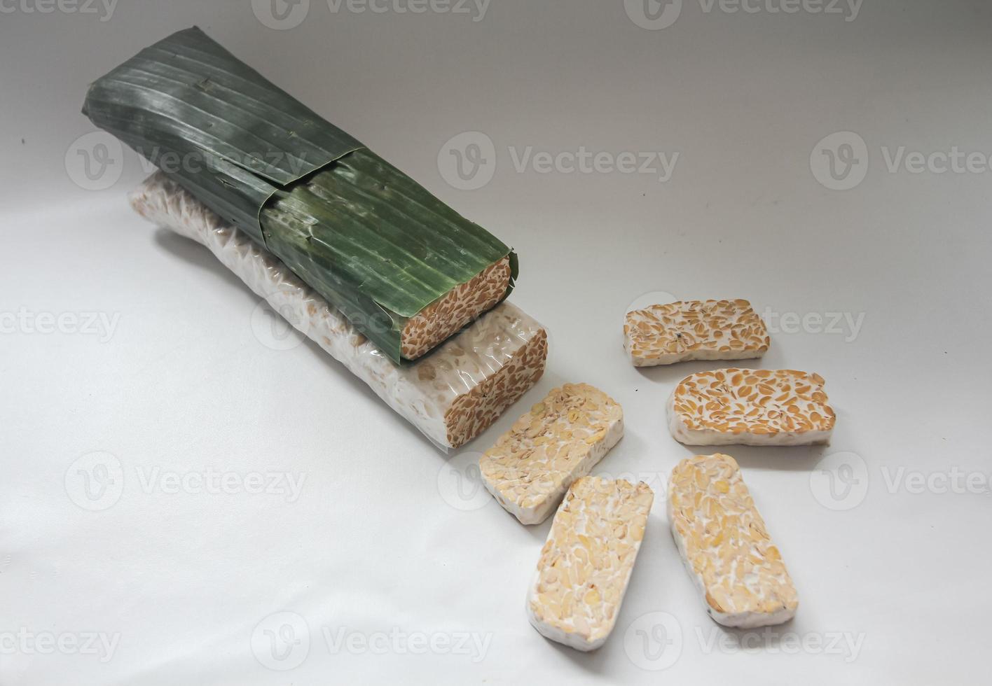 Tempeh Or Tempe is Indonesian traditional food made from fermented soybeans. They are usually wrapped in banana leaves photo