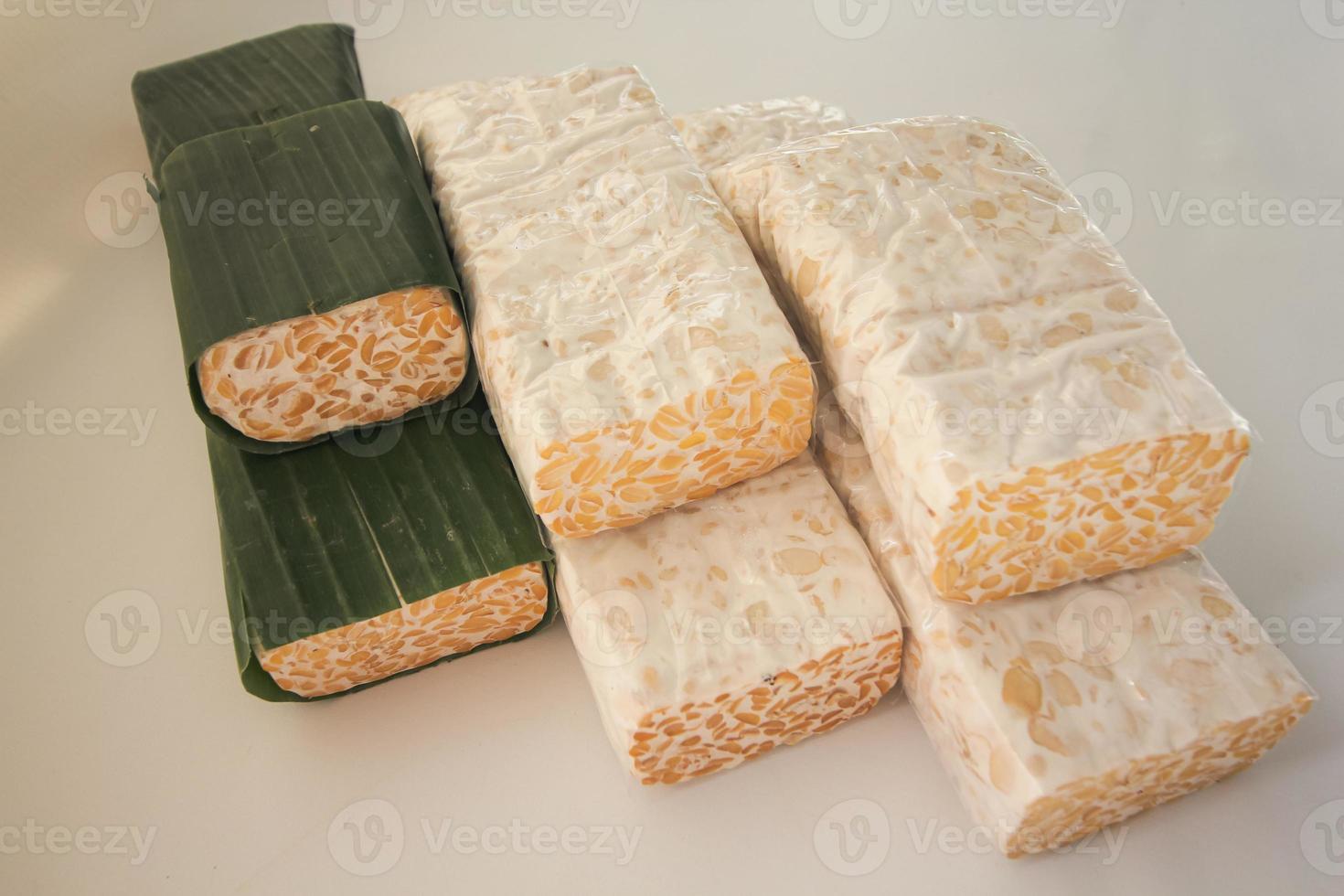 Tempeh Or Tempe is Indonesian traditional food made from fermented soybeans. They are usually wrapped in banana leaves photo