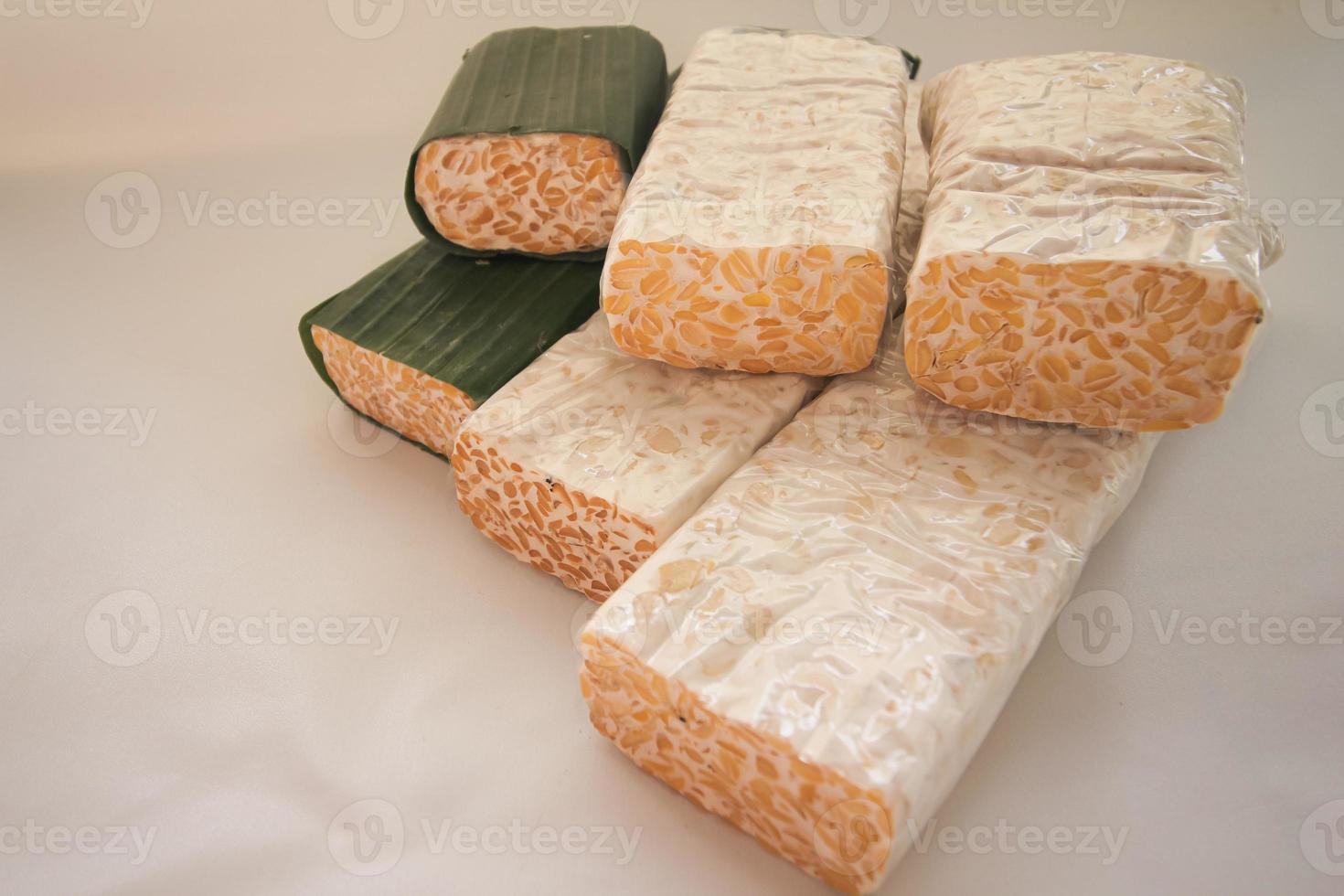 Tempeh Or Tempe is Indonesian traditional food made from fermented soybeans. They are usually wrapped in banana leaves photo