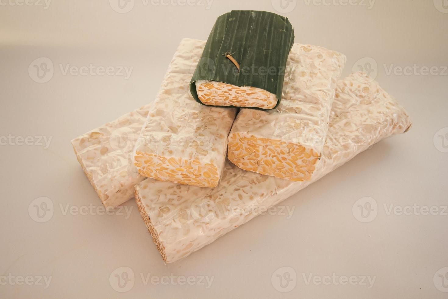 Tempeh or Tempe is Indonesian traditional food made from fermented soybeans. They are usually wrapped in banana leaves photo