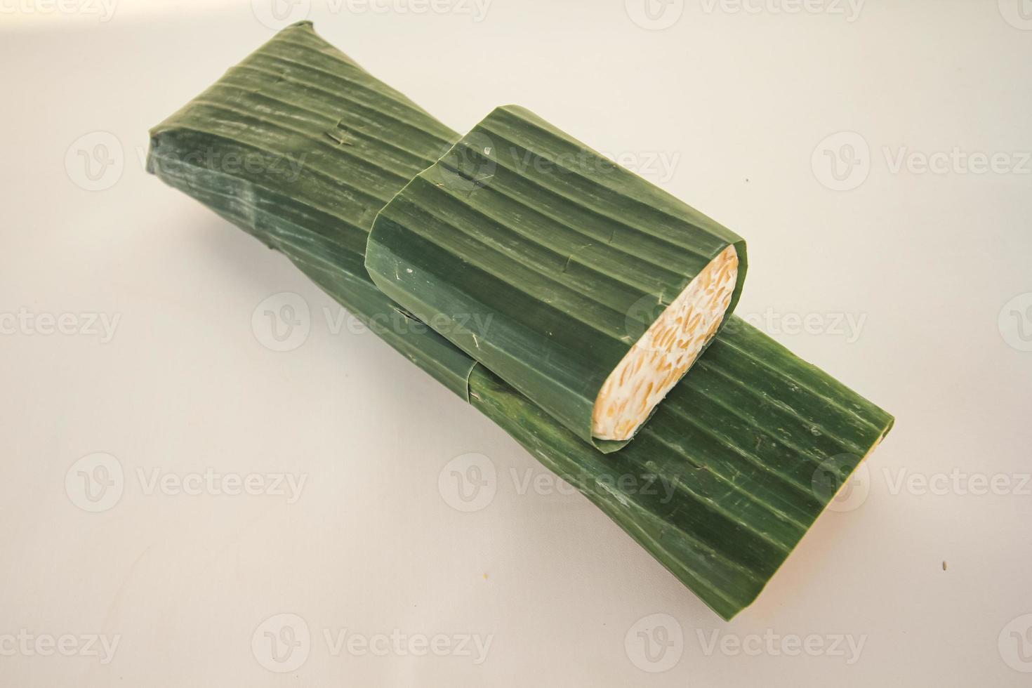Tempeh or Tempe is Indonesian traditional food made from fermented soybeans. They are usually wrapped in banana leaves photo